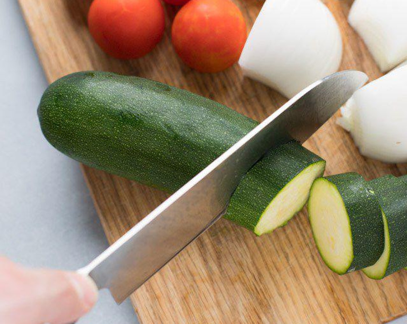 step 1 Cut White Onion (1), Red Bell Pepper (1), Green Bell Pepper (1), and Zucchini (1) into larger chunks. Separate individual onion layers.