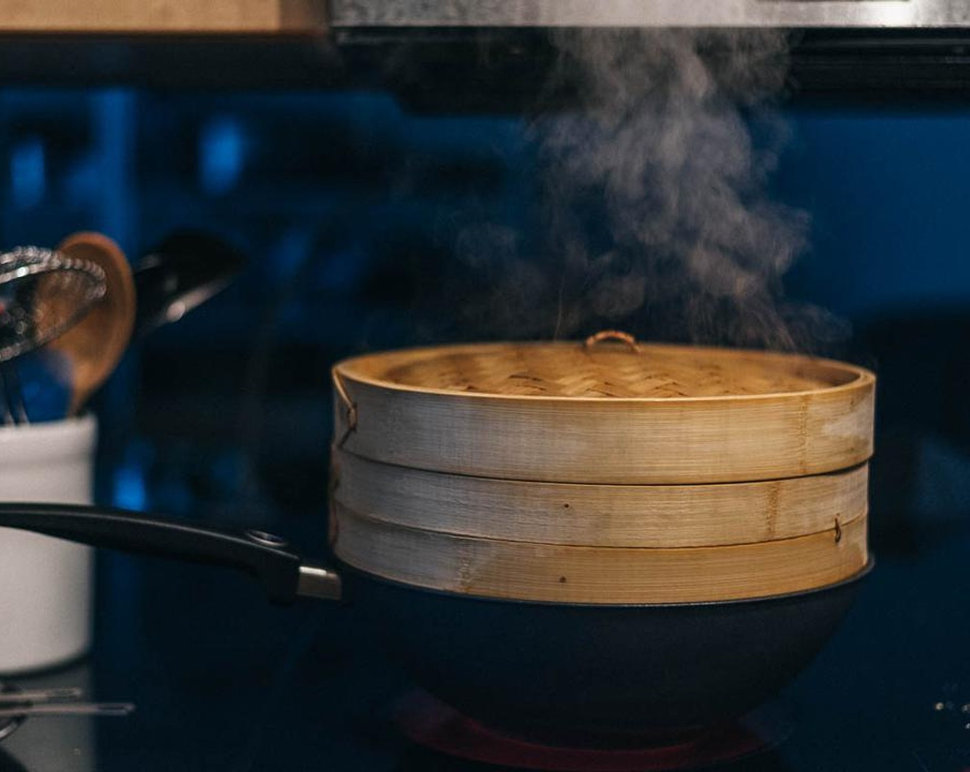 step 6 Place the steaming rack, covered, on top of the wok. You should see steam rising from the top of the steamer. Cook over a medium-high heat until the ribs are just cooked through, 10 to 15 minutes for small bite-size ribs, and 20 minutes for meatier pieces.