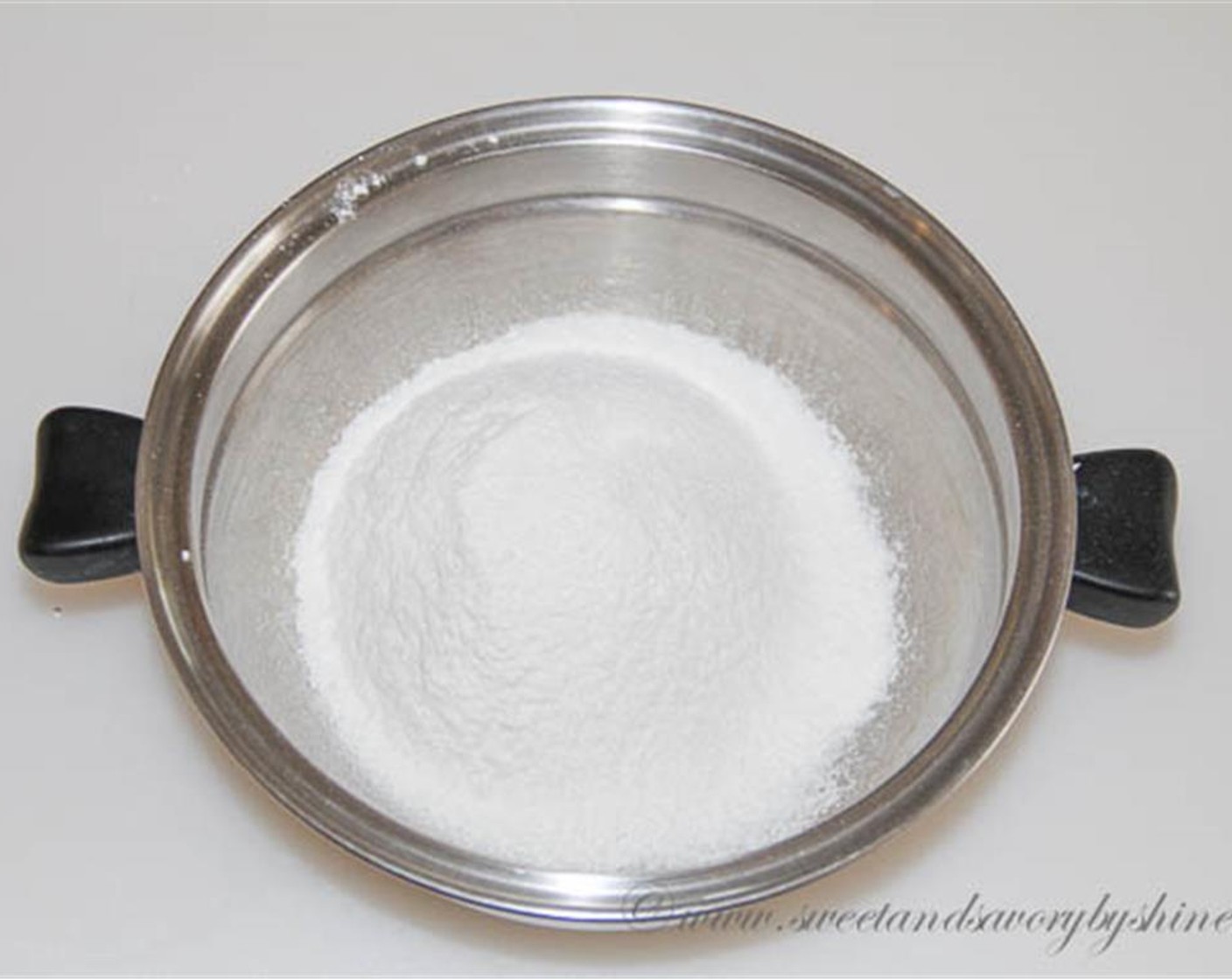 step 2 Sift together Cake Flour (1 cup) and half of the Granulated Sugar (1 1/2 cups)