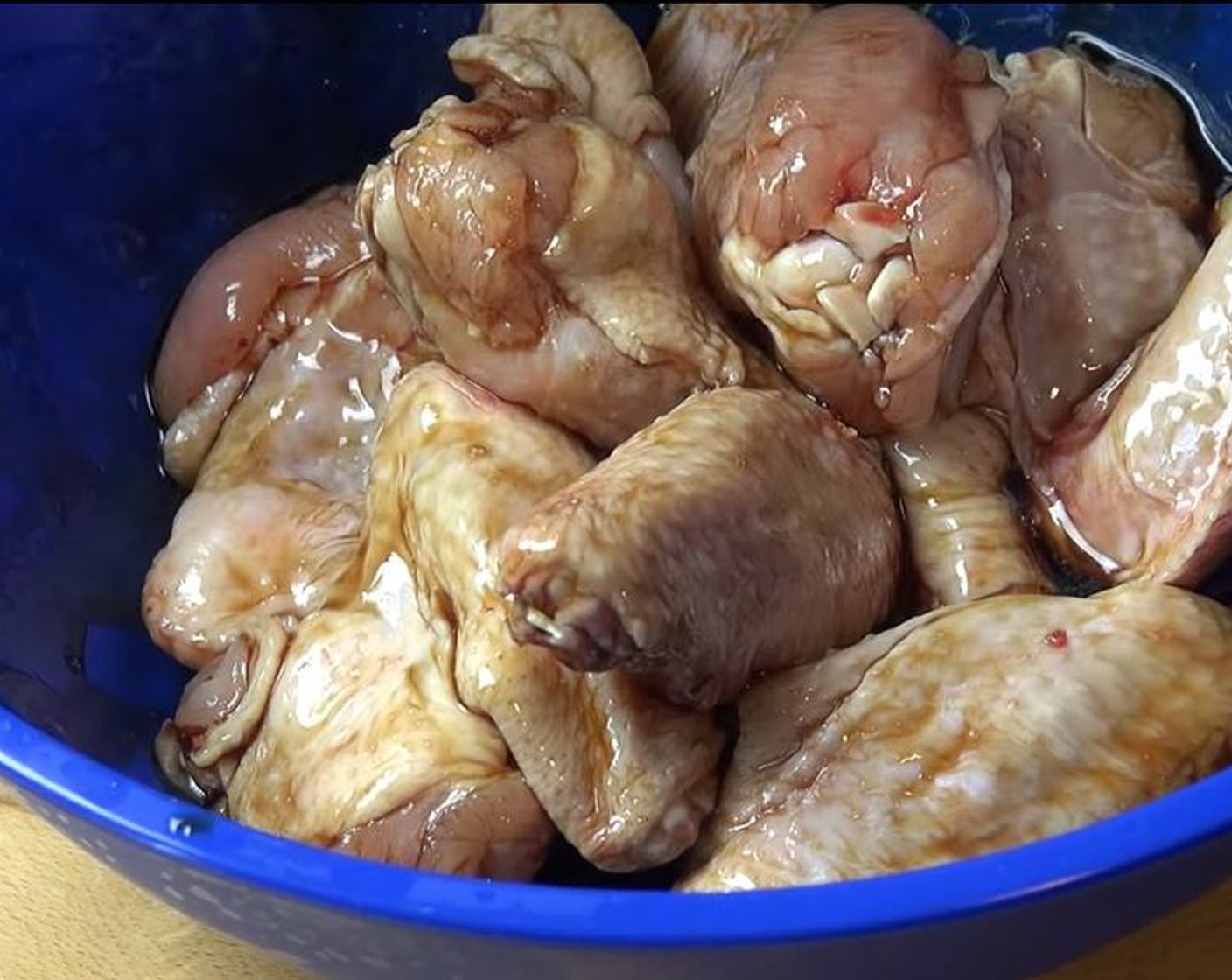 step 2 In a new bowl, pour marinade over Chicken Wings (6). Stir together with hand until chicken is evenly coated. Use a glove to avoid messy hands.