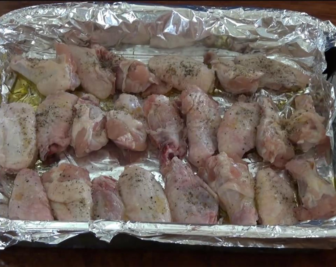 step 3 Drizzle the wings with Olive Oil (2 Tbsp), Salt (1 tsp), and Ground Black Pepper (1 tsp).