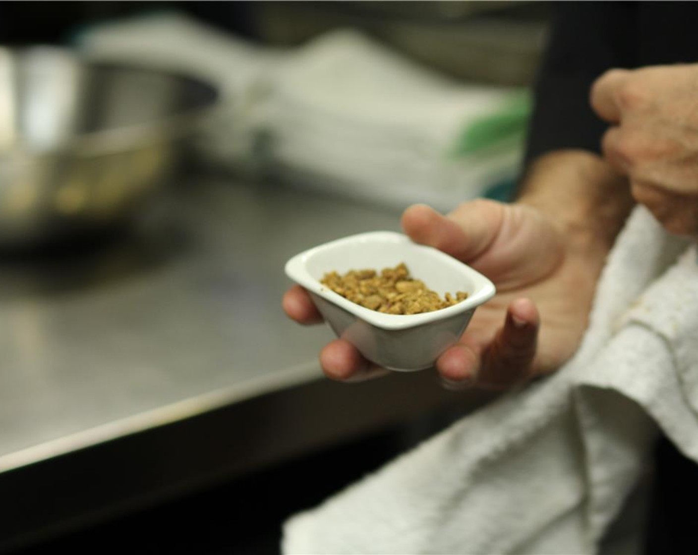 step 5 When sugar takes on a “granola” like look and feel remove from fire immediately onto a paper lined plate and allow to cool at room temperature, never refrigerate.