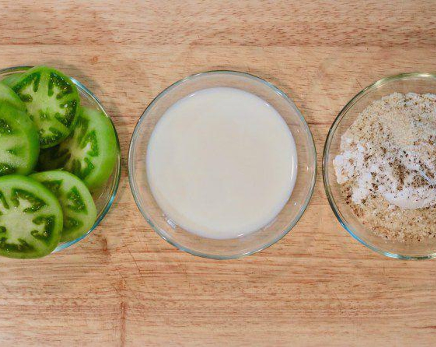 step 2 Put Unsweetened Soy Milk (1/2 cup) in a small bowl and put Whole Wheat Flour (1/2 cup), Panko Breadcrumbs (1/2 cup), Tapioca Starch (1 Tbsp), Salt (1 tsp), and Freshly Ground Black Pepper (1/2 tsp) in another small bowl and mix.