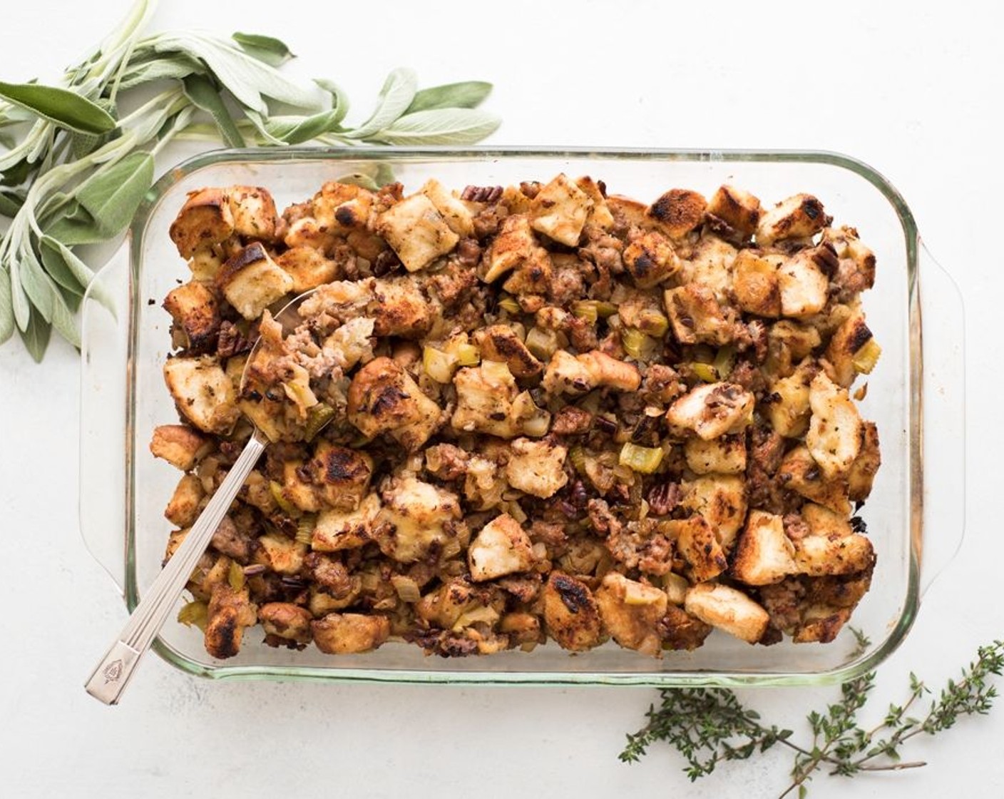 step 9 Transfer the dressing to a large baking dish and cover with foil. Bake for 40 minutes. Remove the foil with 2 minutes left. Place the stuffing under the broiler. Set it to high and cook for 2 minutes. Just enough to brown and crisp the top.