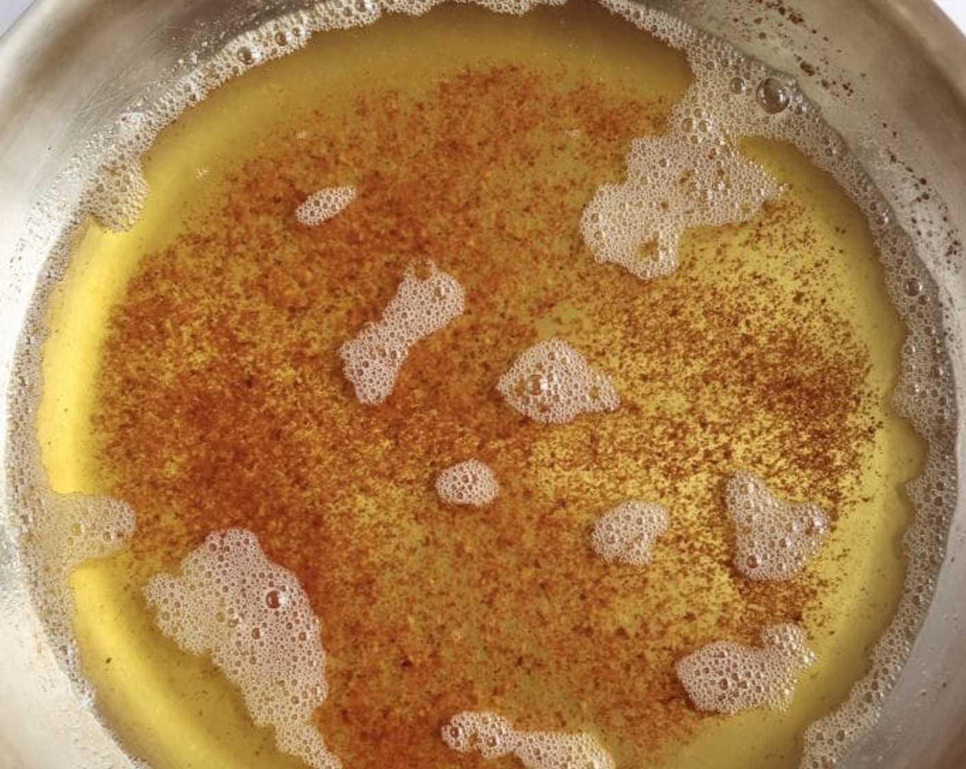 step 1 First, set out a large heatproof bowl to have at the ready. Place Unsalted Butter (1 cup) chunks in a medium-large light-colored skillet.  Melt the butter over medium heat, whisking occasionally. After 5-8 minutes, the butter will start foam and then brown. You’ll start to see brown specks on the bottom and it will have a nutty aroma. When finished the butter will be amber, golden brown and the specks will be brown. Be careful not to burn!