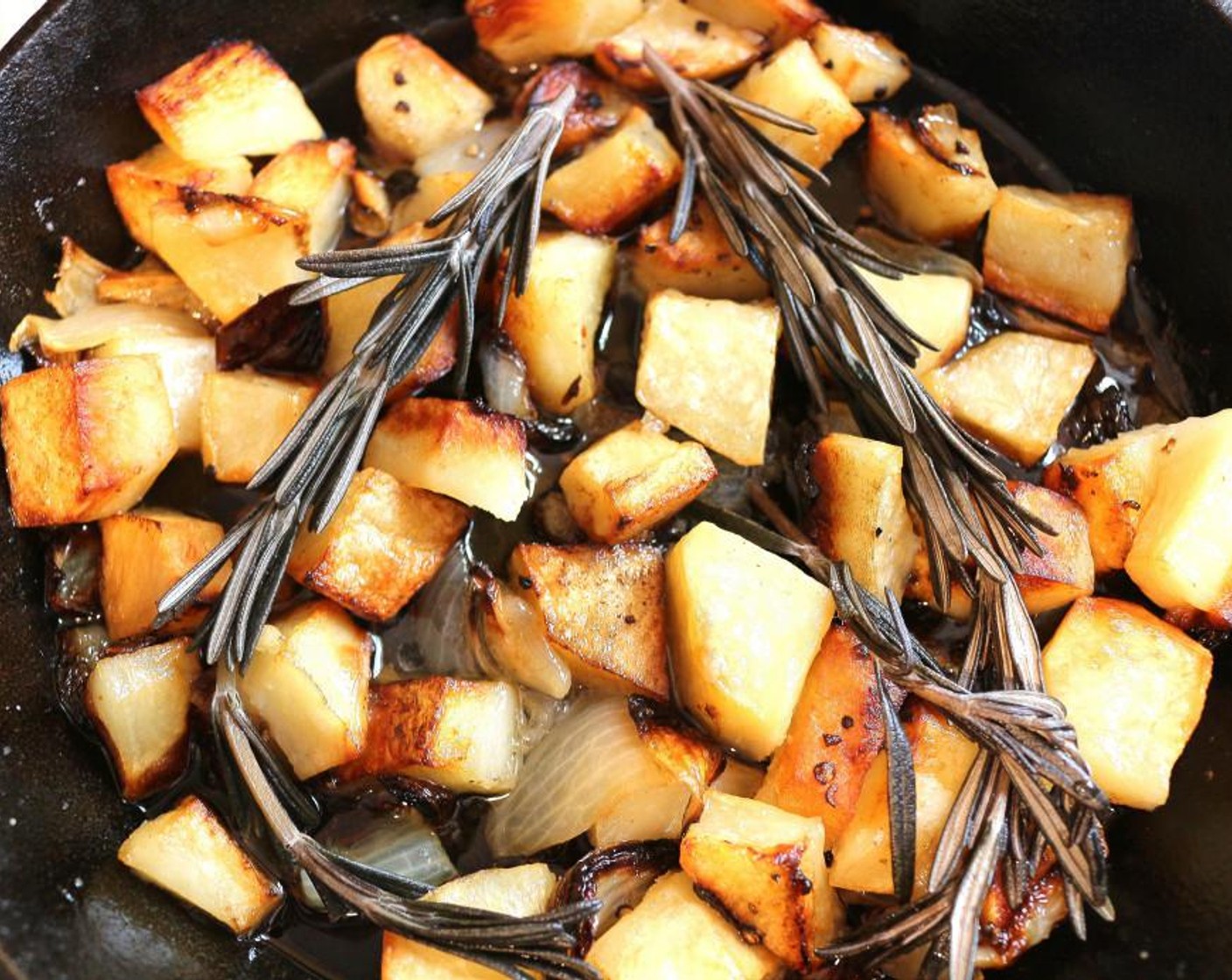 step 4 When the potatoes are golden and the onions caramelized, add Fresh Rosemary (2 sprigs) and Chicken Stock (1 cup). Cook for another 10 minutes.