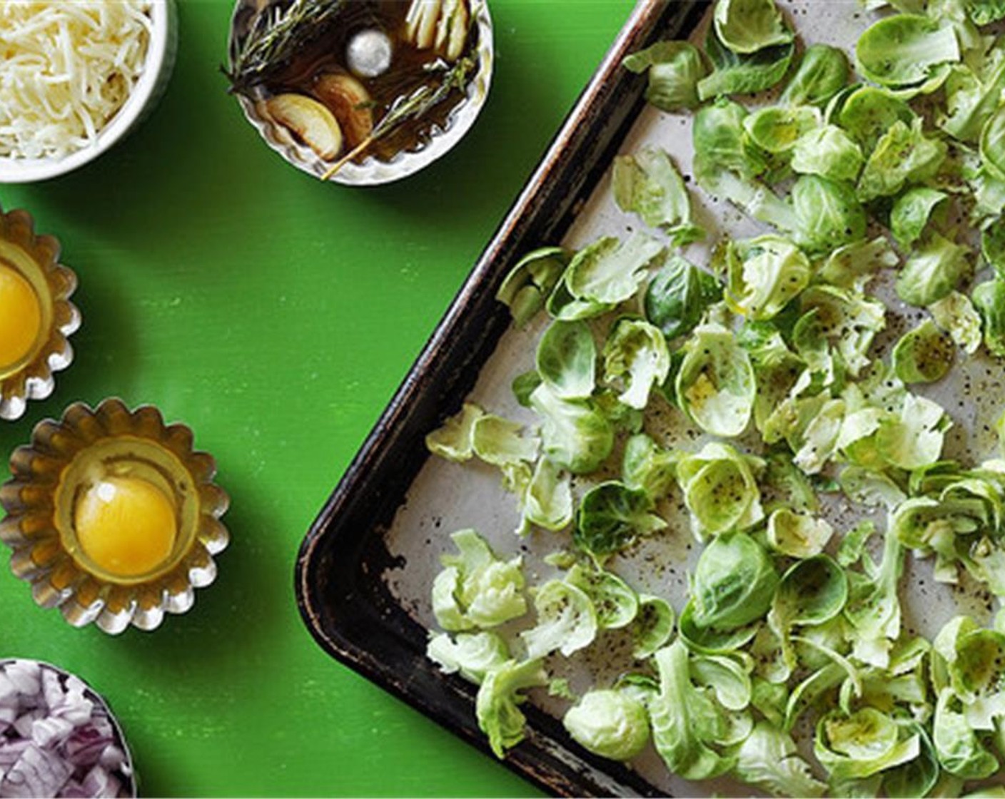 step 6 Separate the Brussels Sprouts (5 cups). Place the leaves and throw them onto a baking sheet. Drizzle with Olive Oil (1 Tbsp) and season with Salt (1 tsp) and Ground Black Pepper (1 tsp).