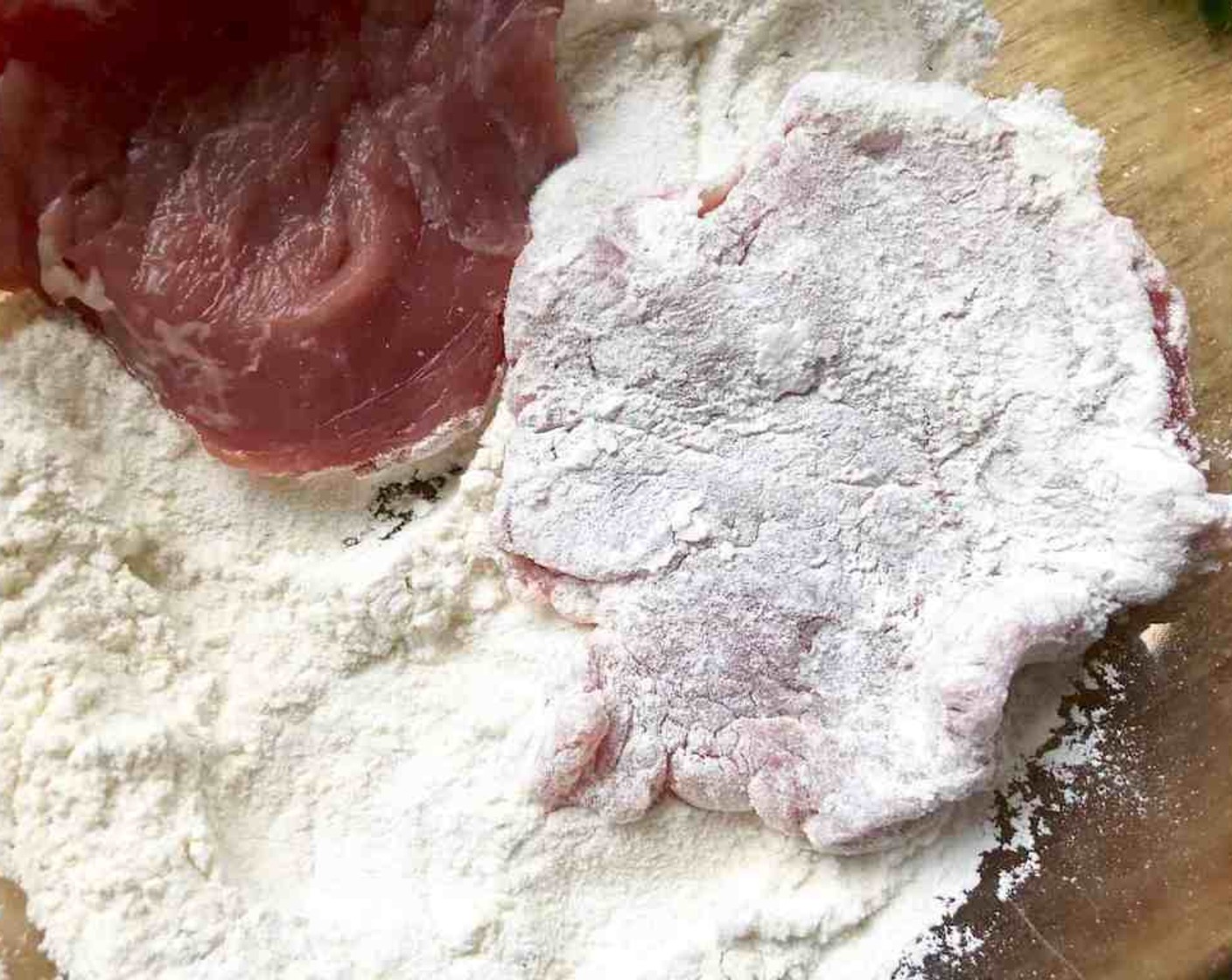 step 4 Combine All-Purpose Flour (1/2 cup), Salt (to taste), and Freshly Ground Black Pepper (to taste) in a shallow dish. Dredge pork pieces in the flour mixture, shaking off excess.