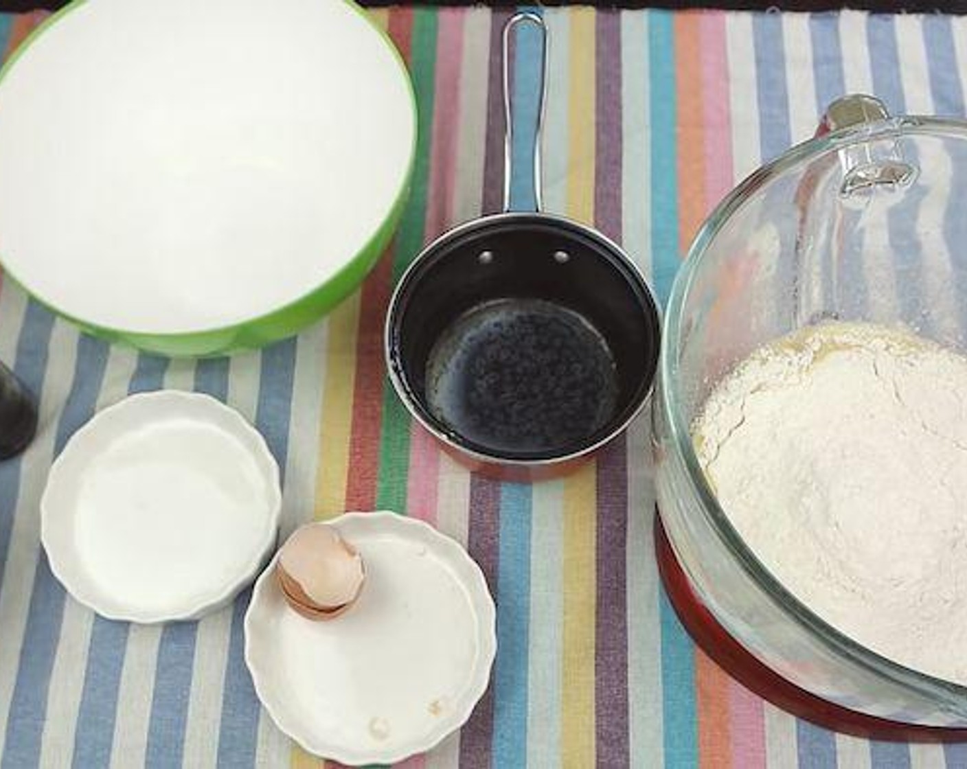 step 2 Then, throw in All-Purpose Flour (2 1/2 cups) and Salt (1/4 tsp). Mix on medium speed until combined. Once combined, continue kneading on medium speed for 5 minutes until smooth. Stop the mixer in between to prevent overheating.