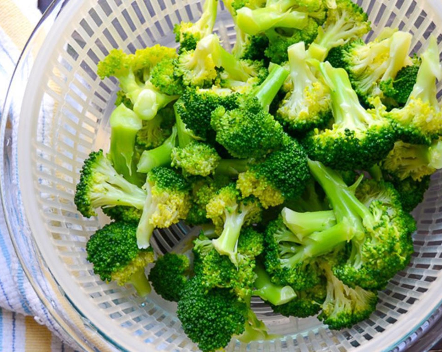 step 6 When broccoli is completely cool, transfer it to a colander and allow it to dry completely. When broccoli is dry, add Olive Oil (1/3 cup), Sea Salt (1/2 tsp), and Ground Black Pepper (1/2 tsp) and toss to coat.