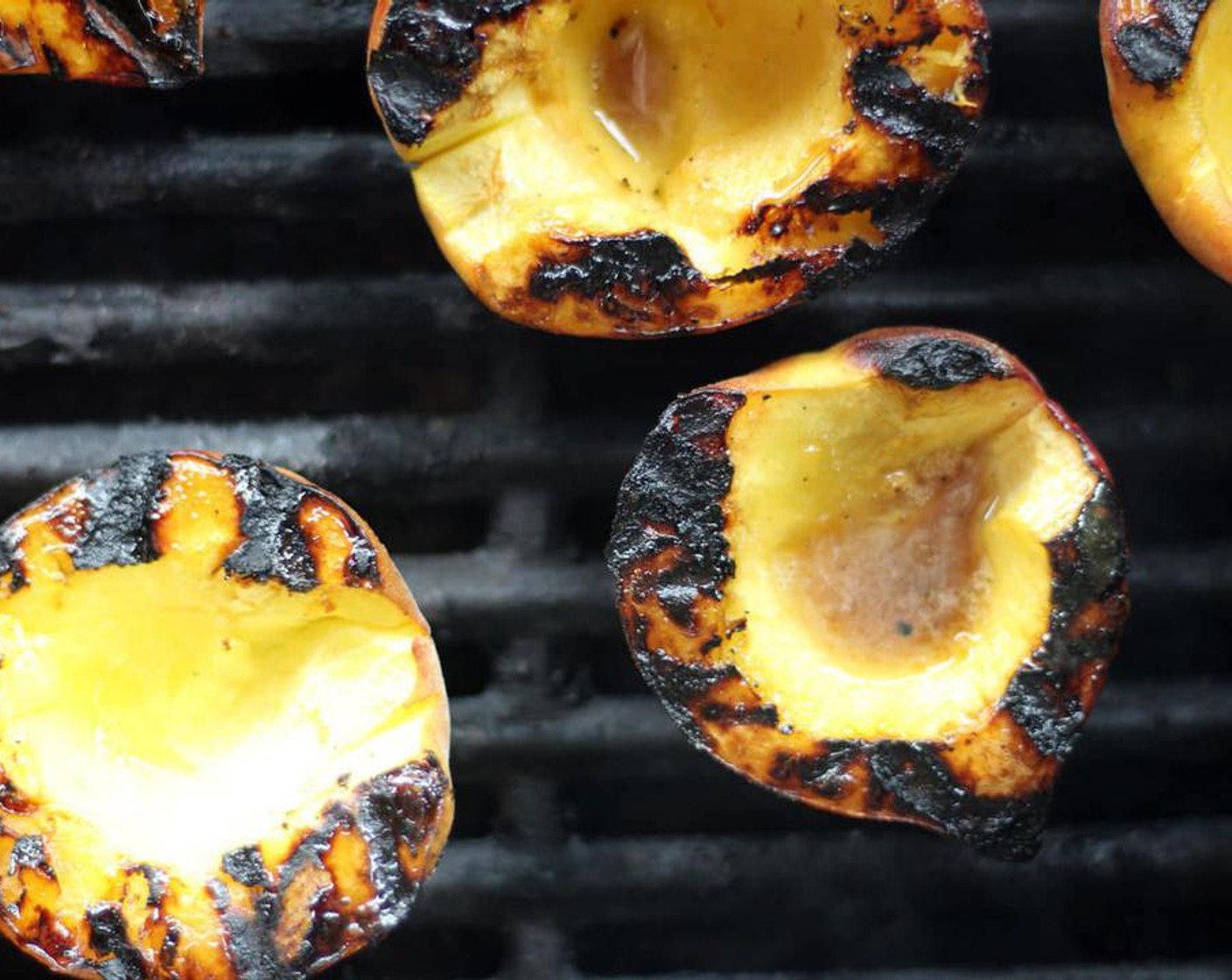 step 4 Cook the peaches to desired doneness, rotating every minute or two.