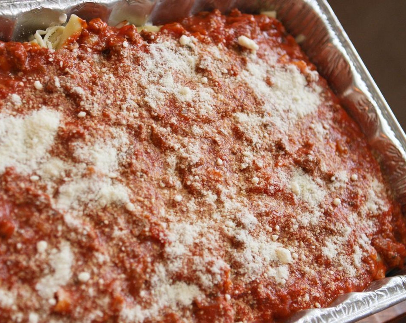 step 10 Add the remaining sauce mixture and top with the Parmesan Cheese (1/4 cup). Bake for 30 minutes in the preheated oven.