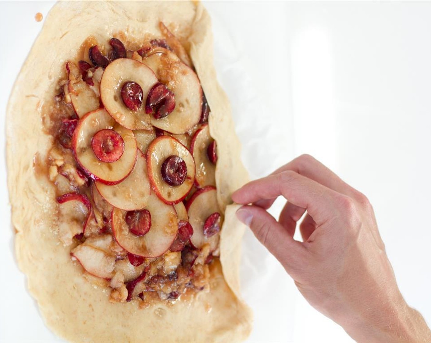 step 6 Fold edges of the dough over the fruit, pleating as you go, forming a 9 inch diameter galette.