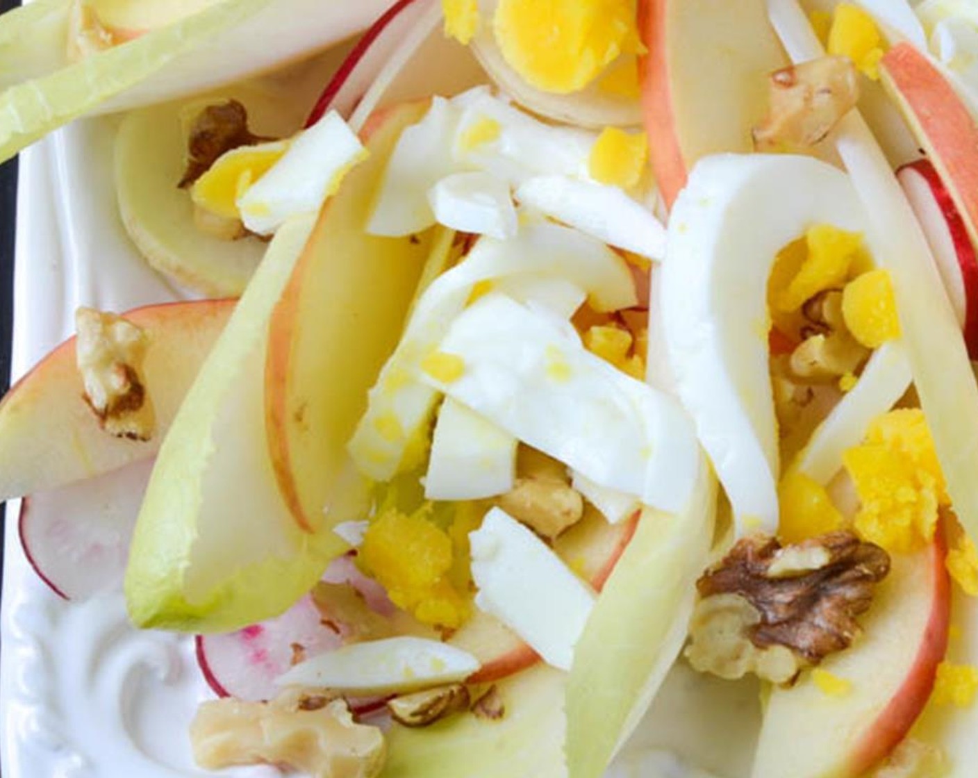 step 7 Dot the roughly chopped hard boiled egg over the salad and sprinkle the roughly chopped Walnuts (2 Tbsp).