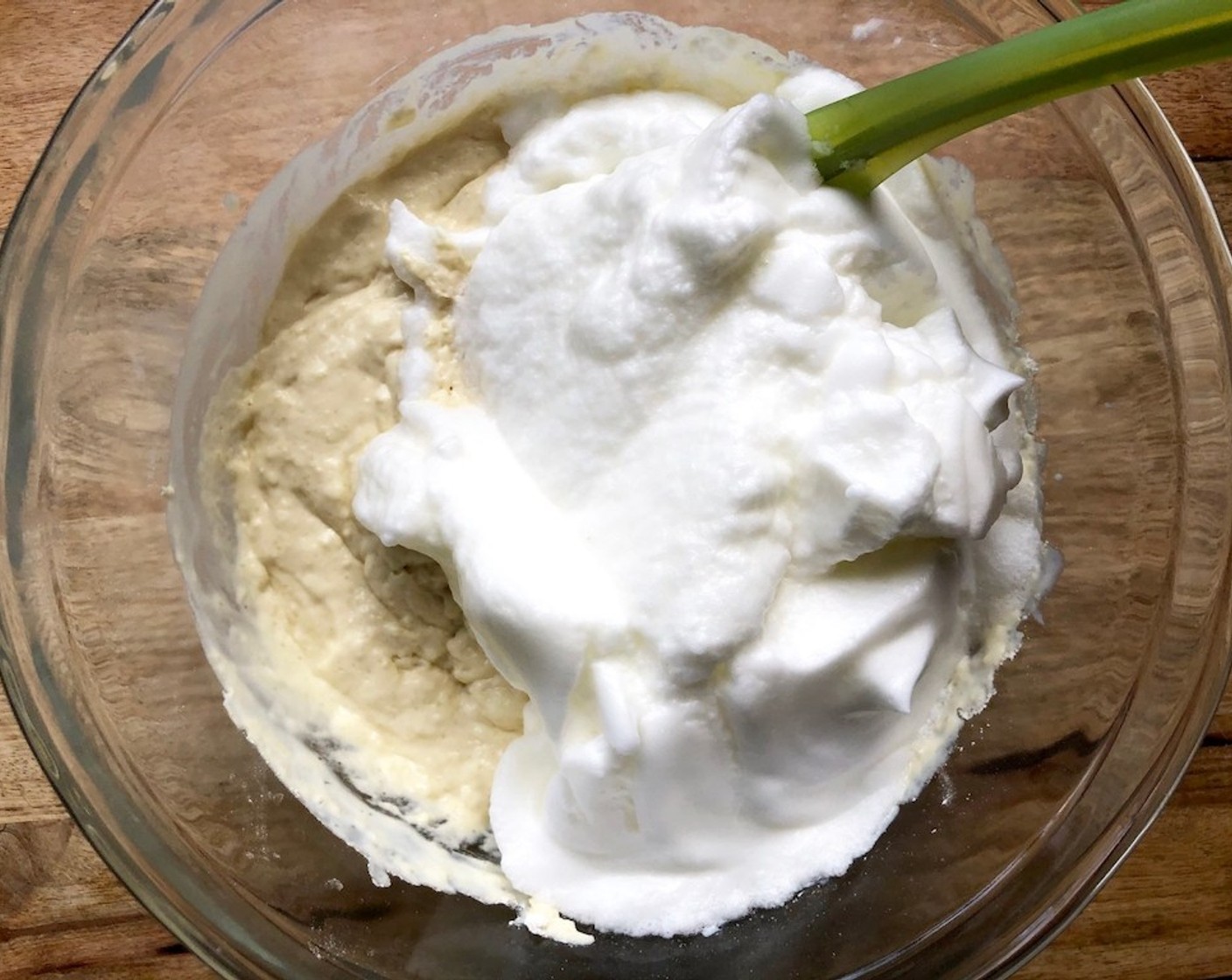 step 6 In the bowl of an electric mixer fitted with the whisk attachment, beat the Eggs (5) on high speed until stiff but not dry peaks form, 2 to 3 minutes. Using a rubber spatula, gently stir the whites into the batter in two additions.