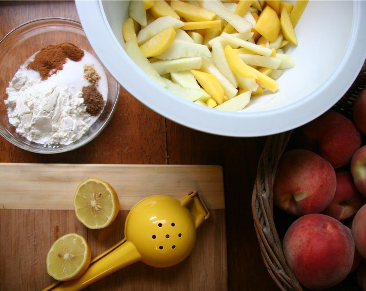 step 4 Sprinkle over peaches and mix to coat. Add the juice from Lemon (1) and stir again. Let sit while preparing the pie crust.