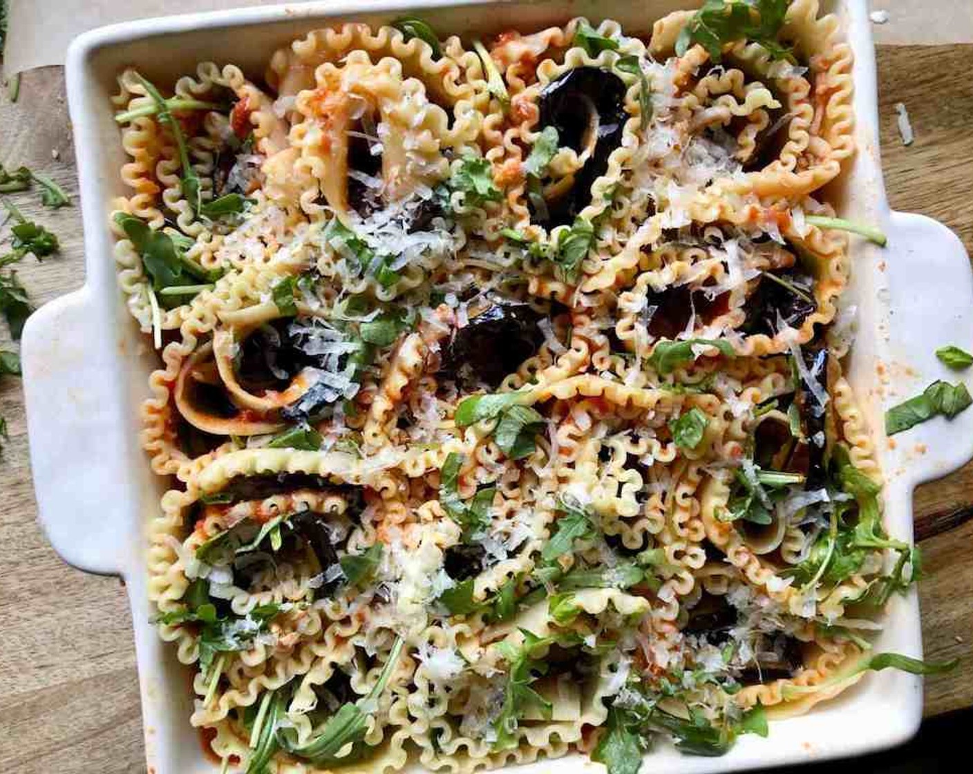 step 11 Continue with the remaining lasagna noodles and eggplant slices until you have 16 spirals in the baking dish. Top with any remaining Parmesan and mozzarella.