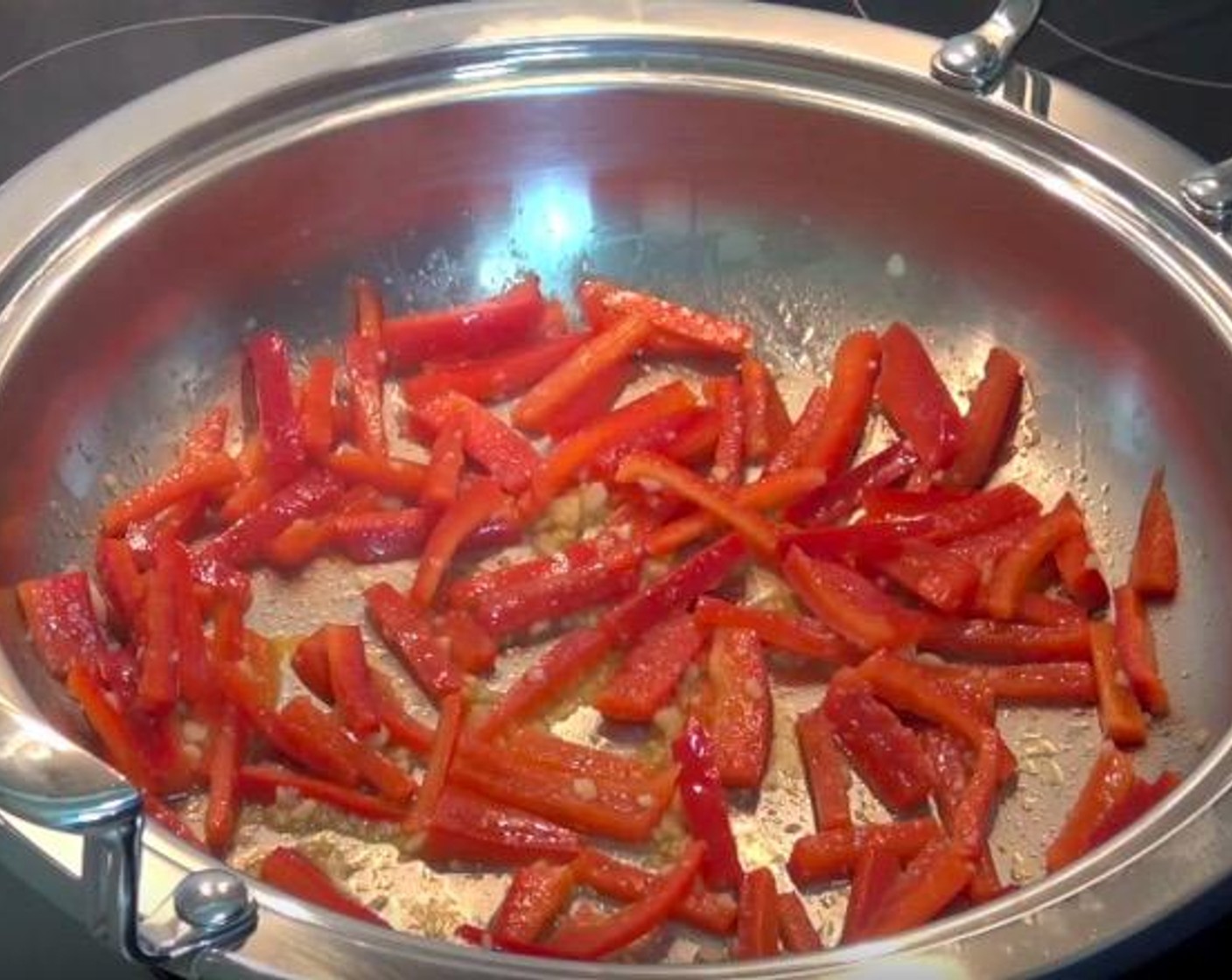 step 1 In a heavy-based pan, add Olive Oil (1 splash), Garlic (2 cloves) and Red Bell Peppers (2). Cook, stirring, over a medium-high heat for 2-3 minutes, or until bell peppers begin to soften.