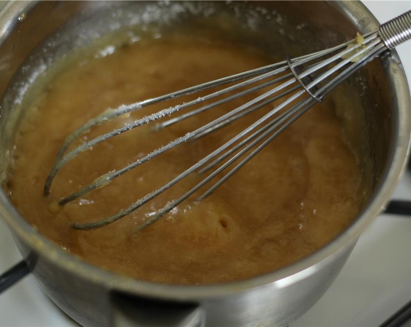 step 3 Add Granulated Sugar (1/3 cup) and cook over moderate heat, whisking, just until dissolved.