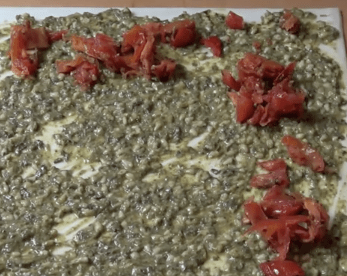 step 3 Spread the sauce all over the surface of the pastry. Then scatter over some Sun-Dried Tomatoes (1 cup).
