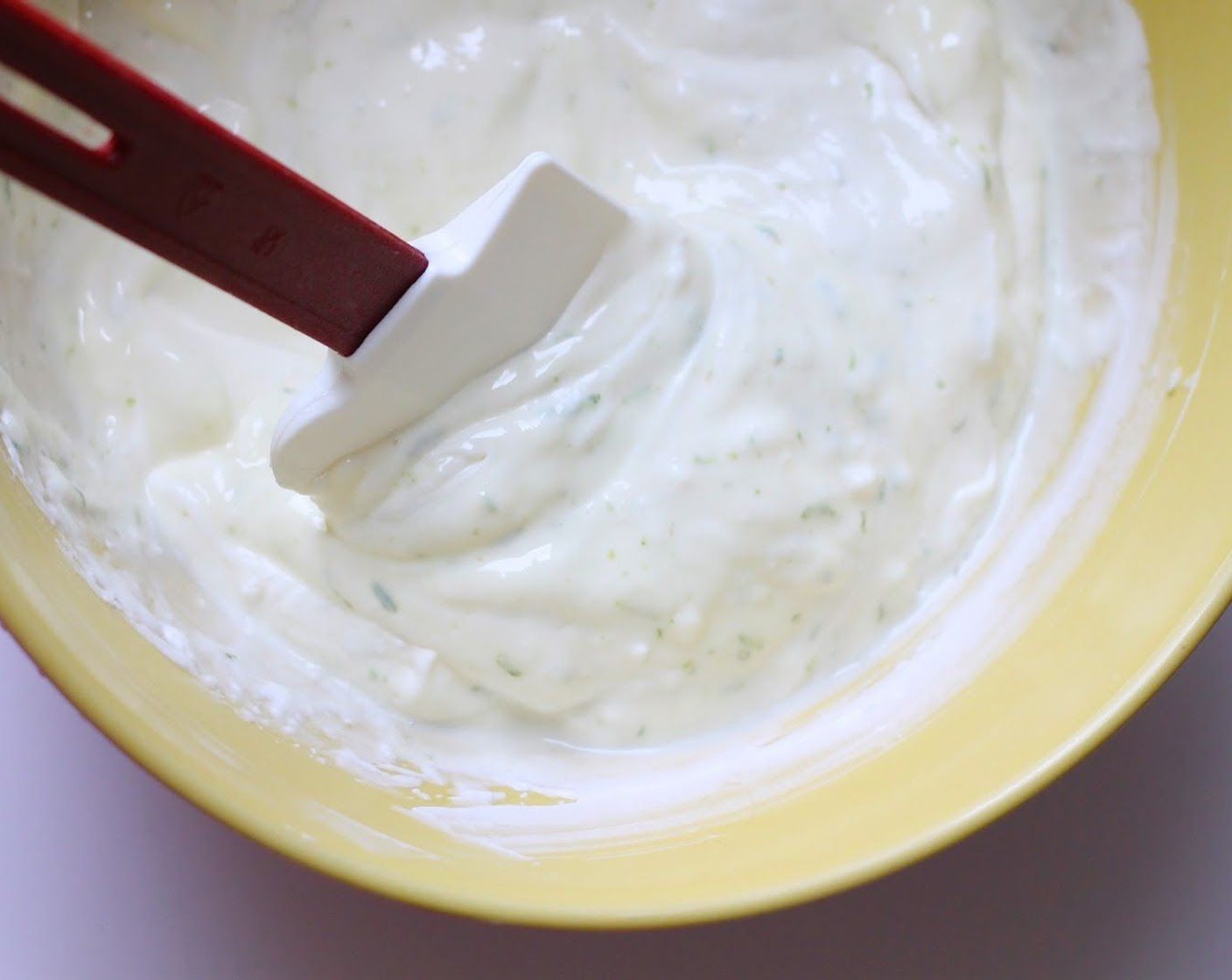 step 9 Fold the yogurt mixture into the whipped cream. Stir until well blended.