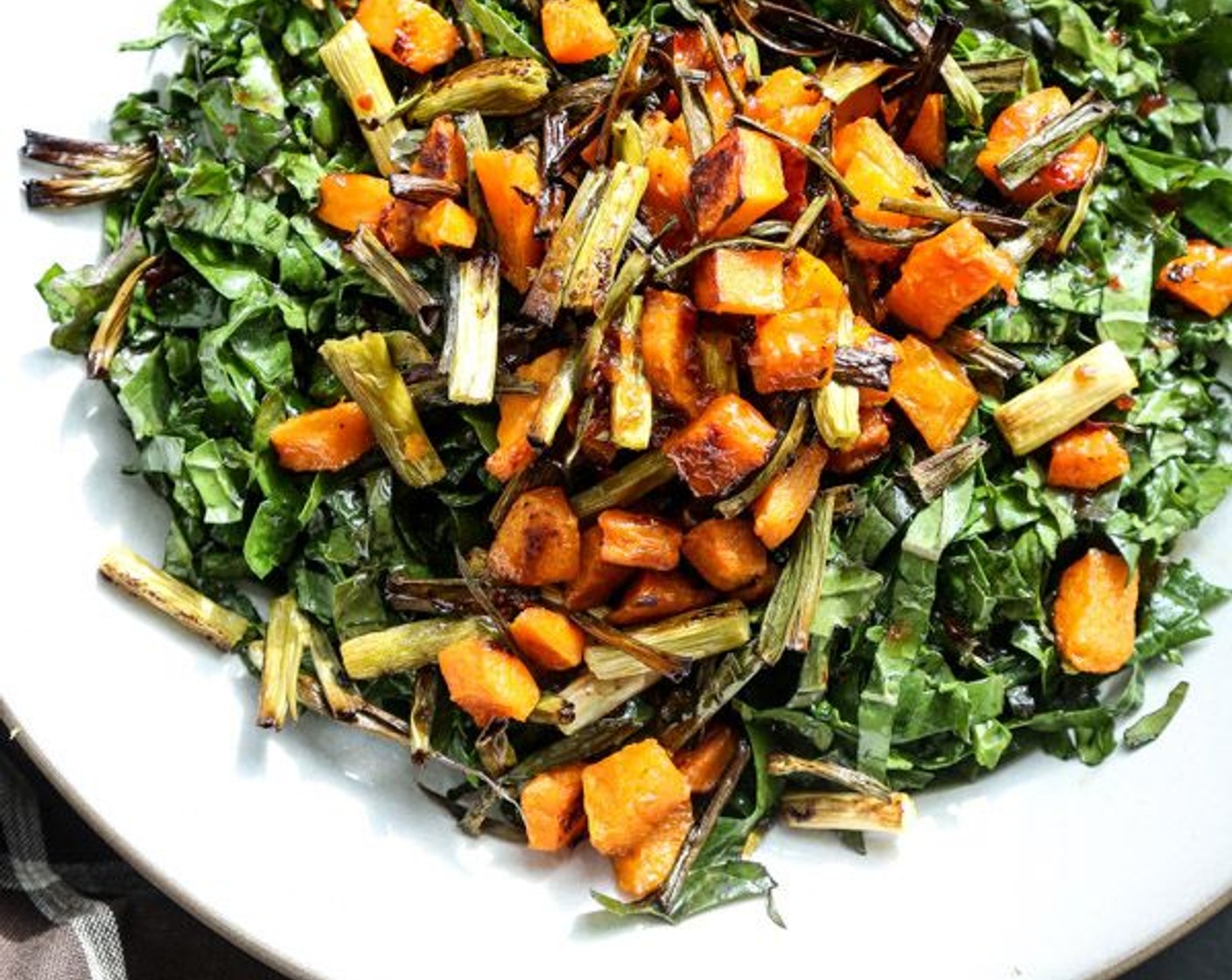 Massaged Kale Salad with Roasted Butternut Squash, Crispy Scallions and Sweet Chili Dressing