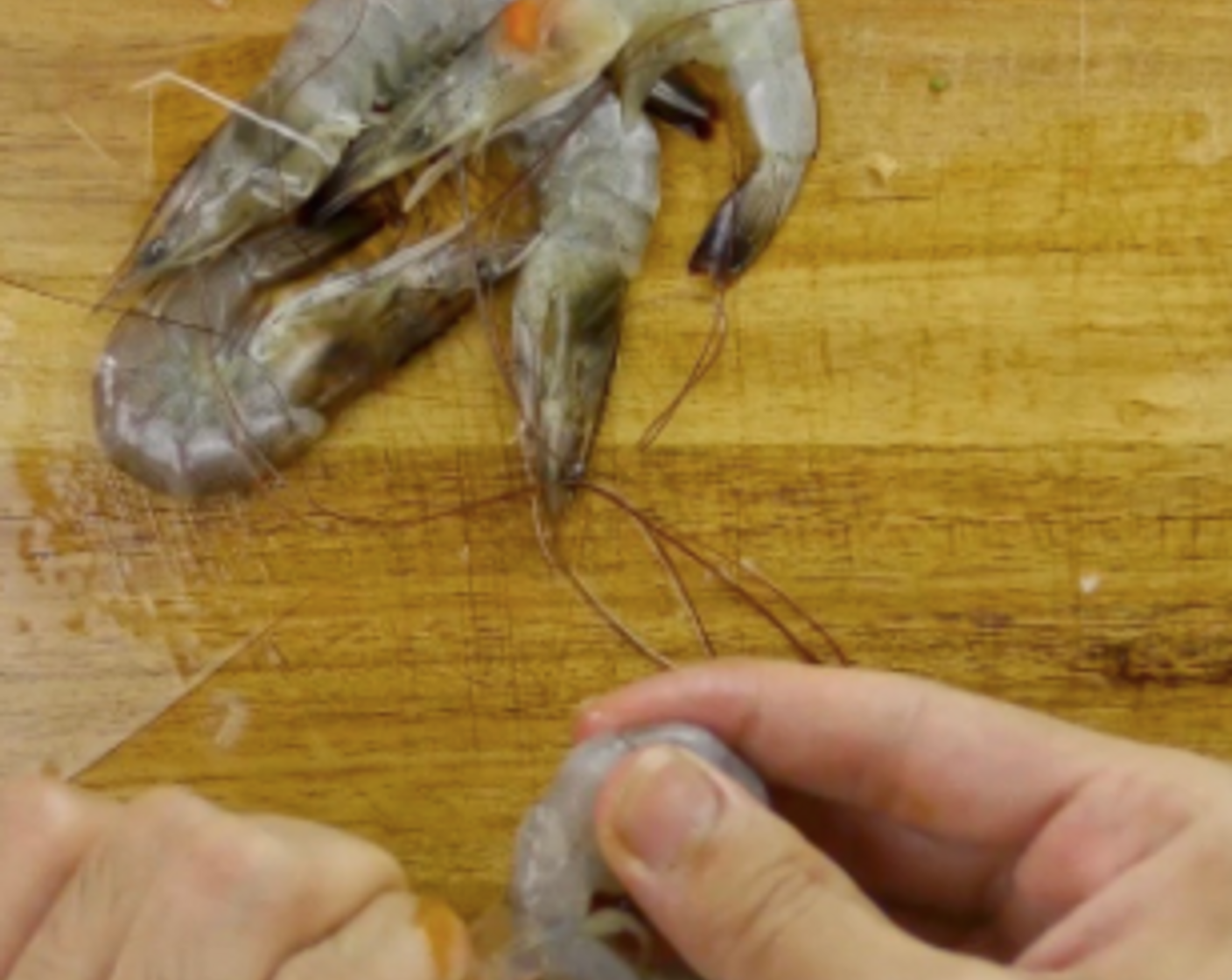 step 1 Start by cleaning some Prawns (8). Peel the shell off.