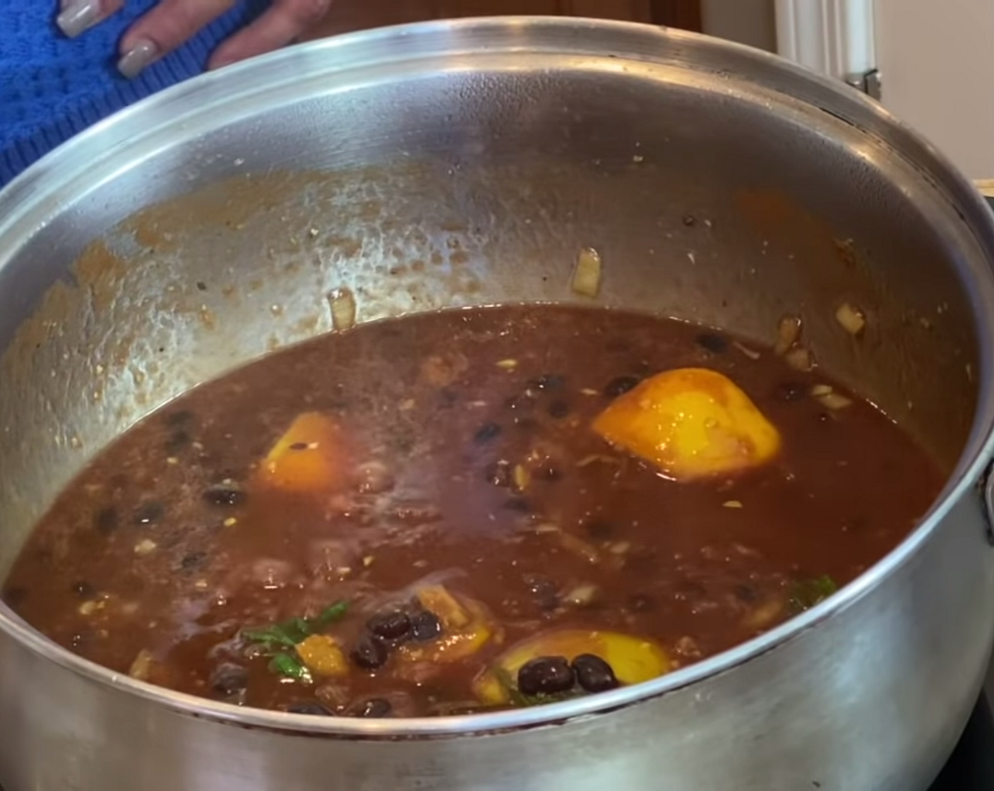 step 3 Once it's simmering add Tomato Sauce (1 can), stir, and then add the Black Beans (1 can).