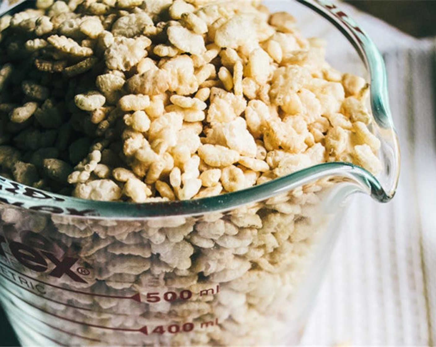 step 4 Add the Vanilla Extract (1 tsp) and Banana (1/2) and stir well. Then slowly add the Gluten-Free Toasted Rice Cereal (5 cups) to the warm smooth mixture and stir until thoroughly combined.