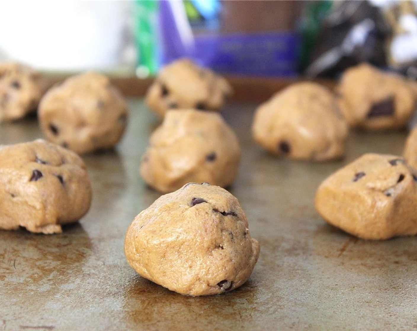 step 4 Using a spoon, measure out the batter and place on a baking pan. Bake the cookies for 9-12 minutes, or until the edges are browned and they’re cooked through.