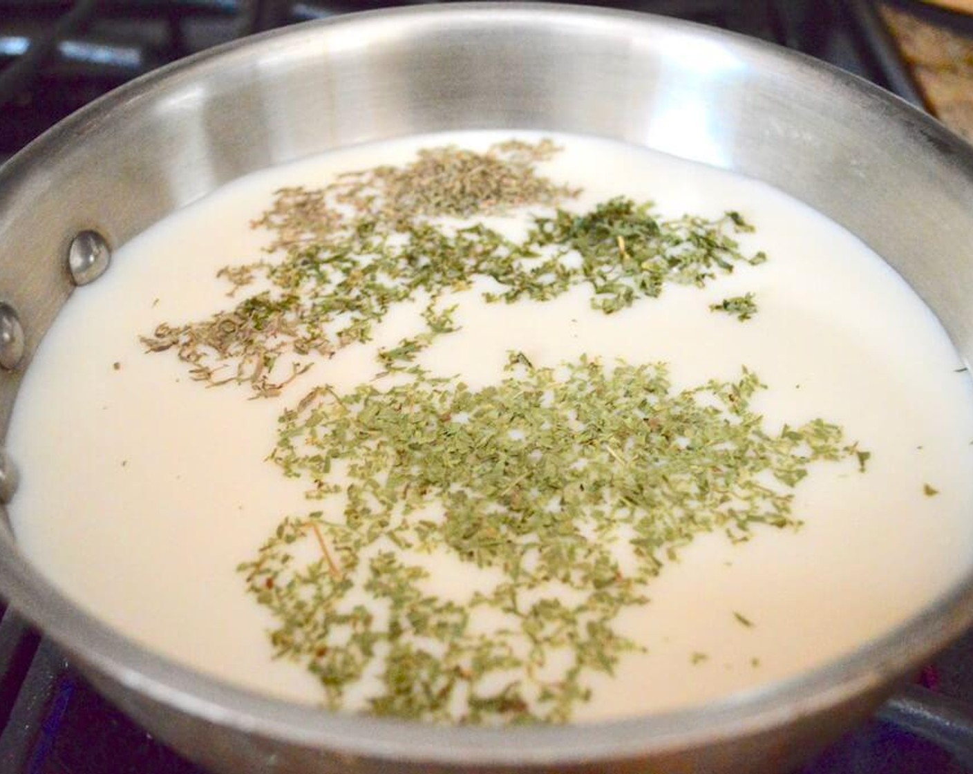 step 2 Then combine the Milk (2 cups), Chicken Stock (2 cups), Garlic (3 cloves), Dried Parsley (1/2 tsp), Dried Tarragon (1/2 tsp), Salt (1 pinch), and Dried Thyme (1/2 tsp) in the saucepan and bring the mixture to a gentle boil over medium high heat. Whisk it a few times to stir it all together.
