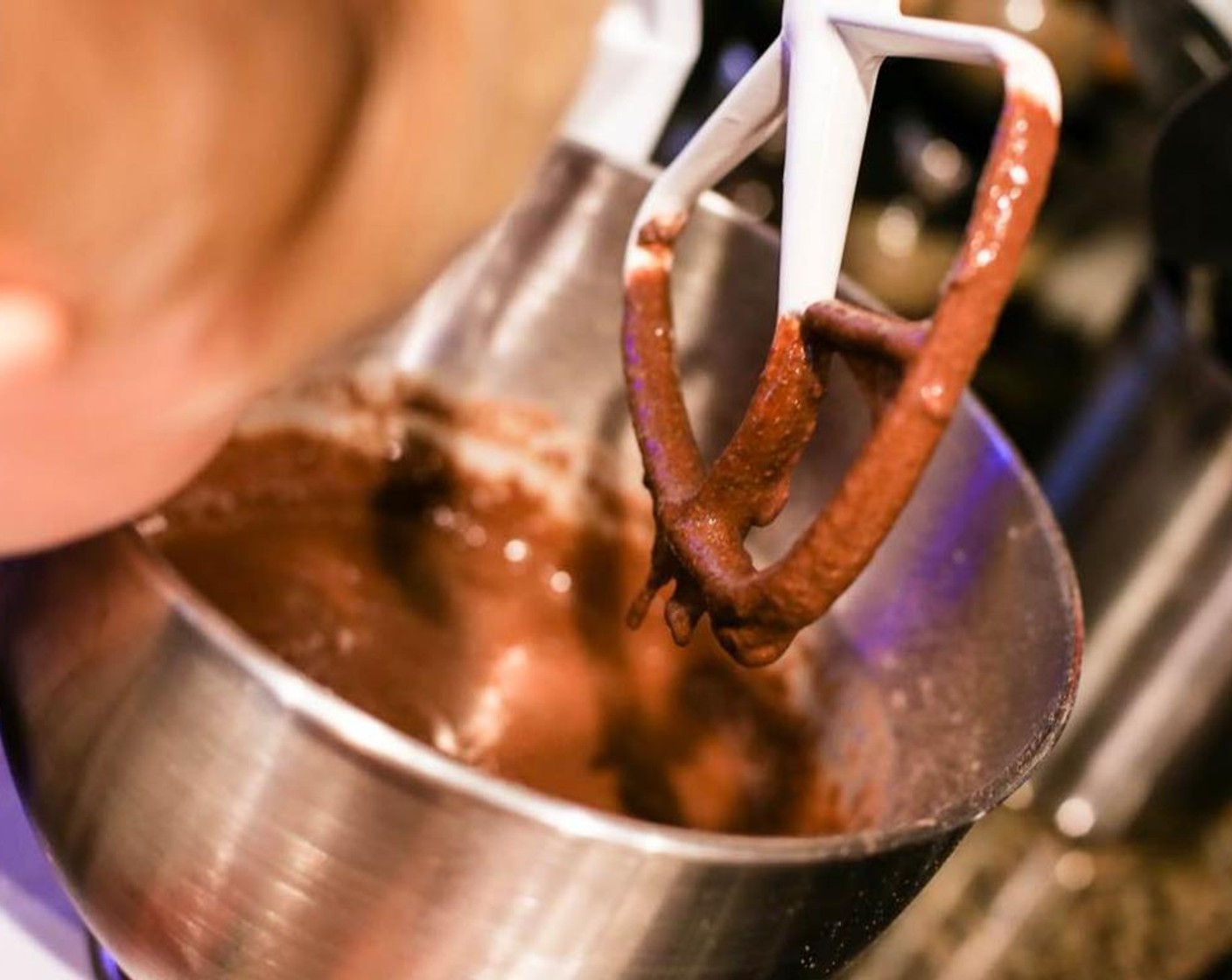 step 4 Slowly add the wet ingredients to the dry while continuing to stir. Mix until smooth. Add the dark chocolate chunks and stir roughly.