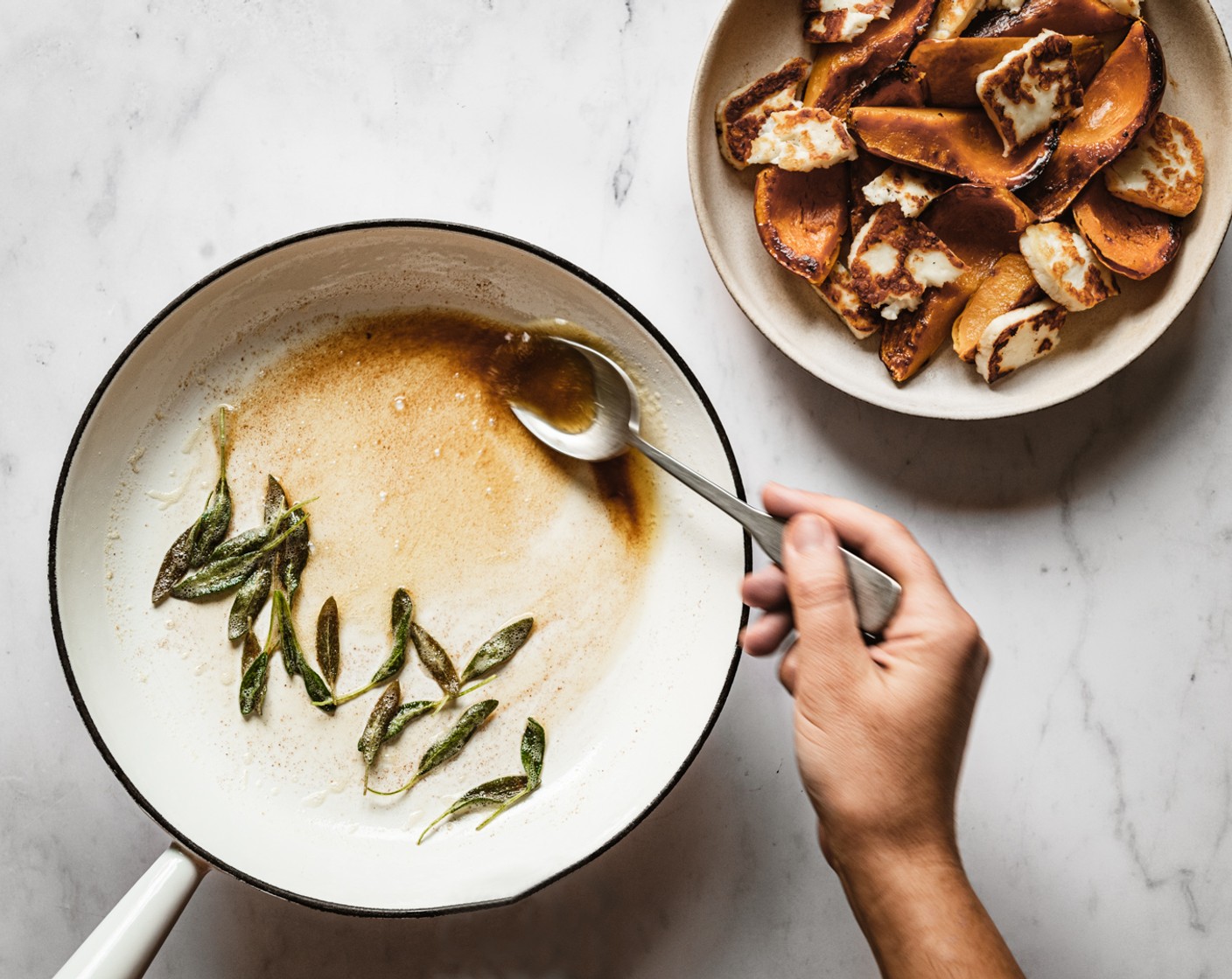 step 6 In the same pan used to fry the halloumi, melt the Salted Butter (1/4 cup) over medium heat until it just begins to turn light golden brown. Add in the Sage Leaves (15) and cook until crisp, about 1 minute. Remove the pan from the heat.