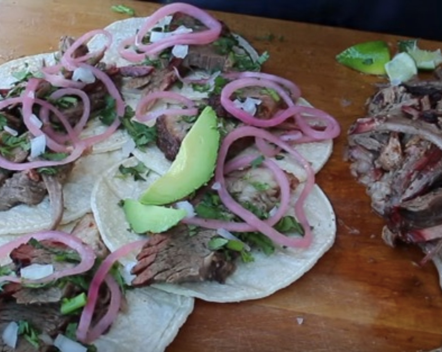 step 13 Add Fresh Cilantro (1 pinch), Pickled Red Onions (1 pinch), White Onion (1 pinch), Avocado (1 slice), and Limes (to taste).