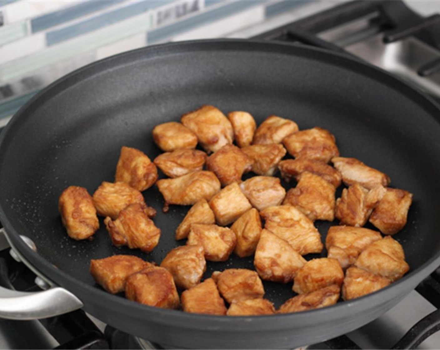 step 6 Heat Canola Oil (1 Tbsp) in a 12 inch nonstick skillet and set to  to medium heat and then cook the chopped Skinless Chicken Breasts in two batches. About 2-3 minutes per side.