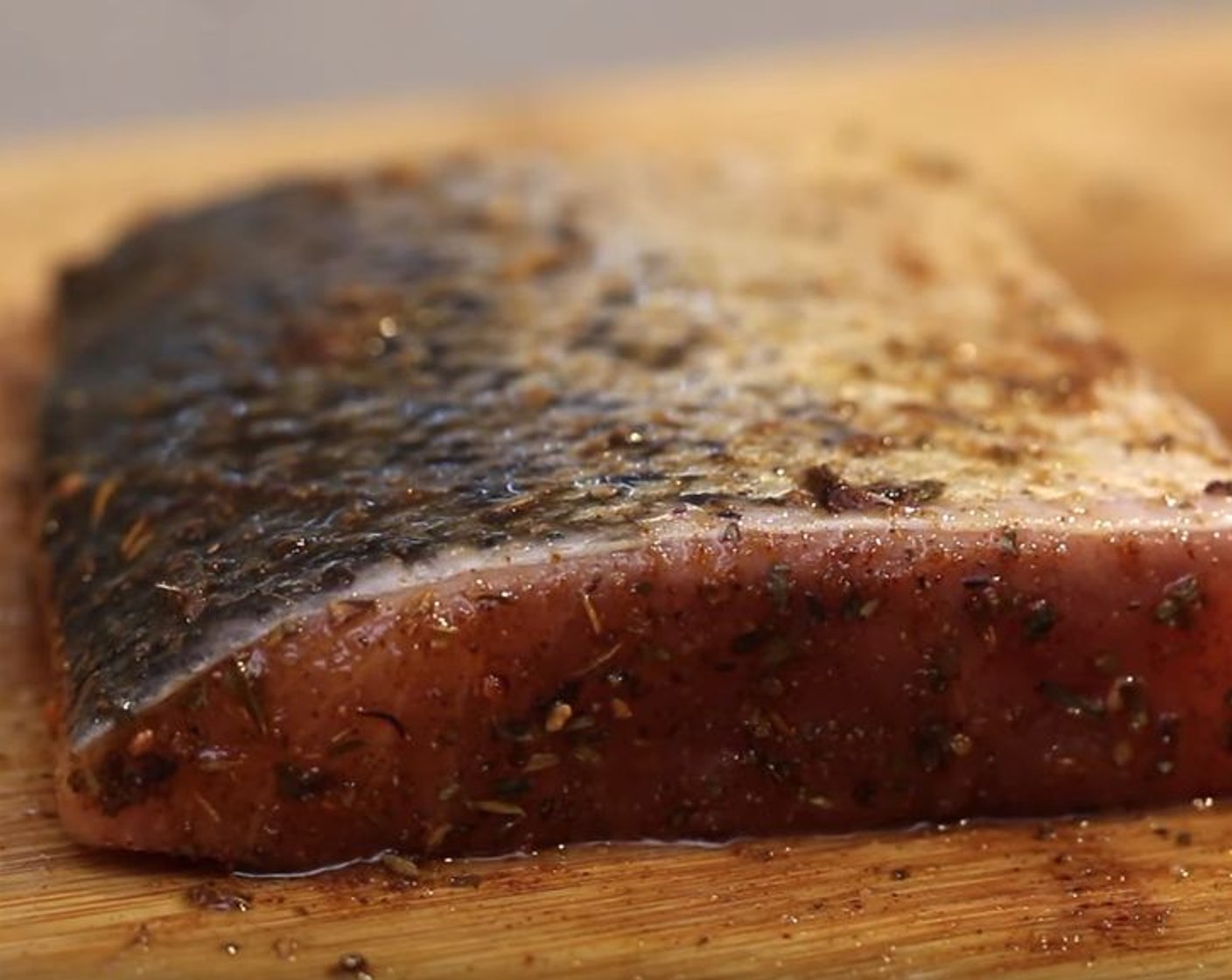 step 4 Drizzle Olive Oil (as needed) over the Skin-On Salmon Fillets (4), then rub the fish with the spice mix.