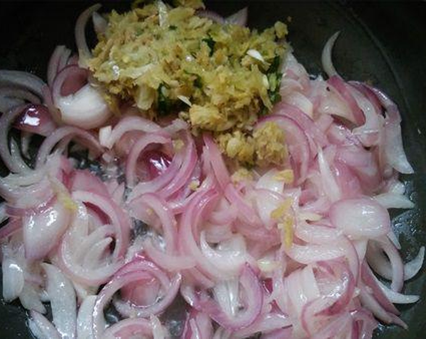 step 2 To a pan, pour Oil (3 Tbsp) and Onions (3) and saute until the onion becomes soft. Then add Fresh Ginger (1 Tbsp), Garlic (1 Tbsp), Green Chili Peppers (4) and saute till the raw smell goes.