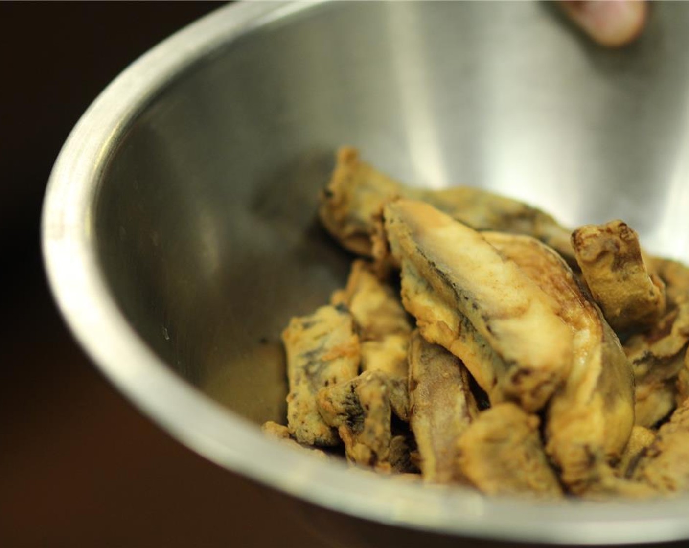 step 3 Fry in a deep fryer with Canola Oil (as needed) for about a minute and a half. You will see bubbles float to the top and get smaller.