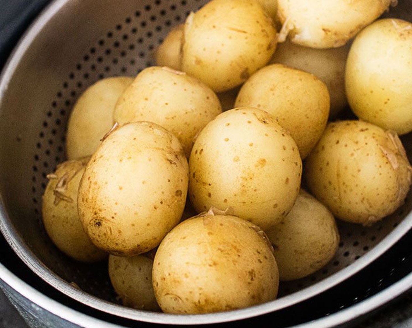 step 2 Drain the pot and shake the potatoes through a sieve to remove excess water, set aside and allow to dry for a few minutes.