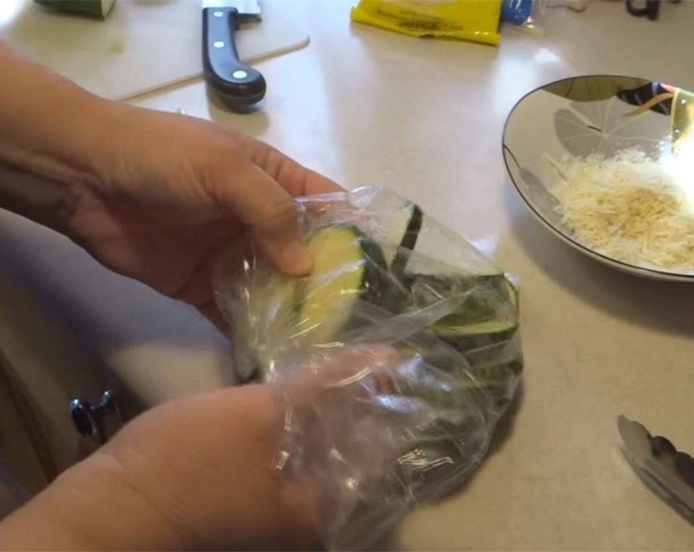 step 3 Place 1/4 thick slices of Zucchini (3 1/2 cups) in a plastic bag with Olive Oil (1 Tbsp) and shake to coat evenly.