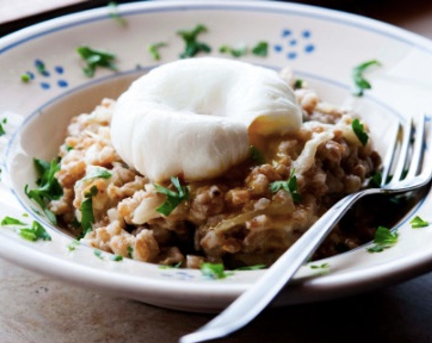 step 9 Plate your risotto and lay one poached egg on top of each serving. Sprinkle some Parmesan Cheese (to taste) if you like, and serve it immediately. Enjoy!