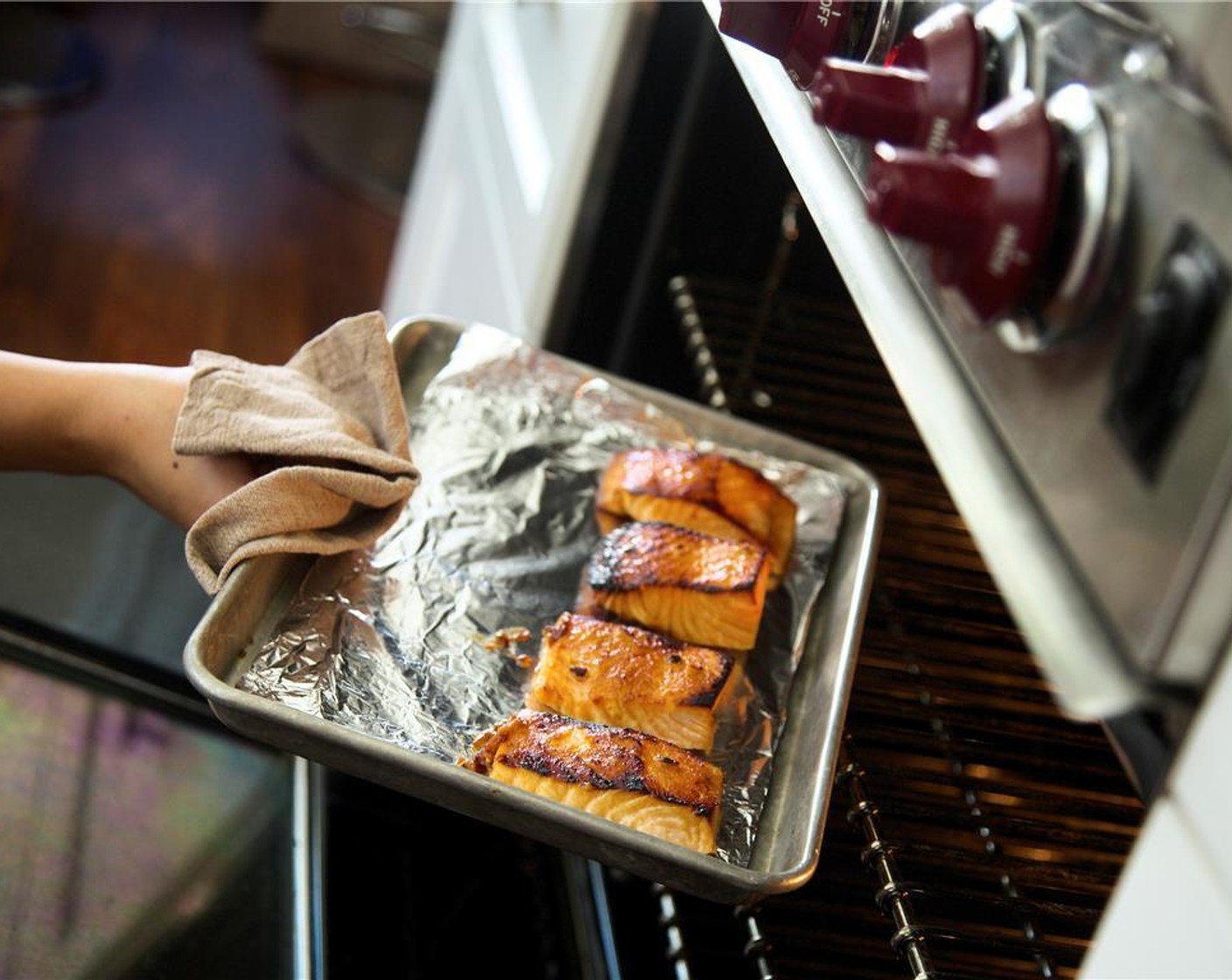 step 12 Evenly place salmon on a baking sheet pan lined with foil, being sure to have some marinade still on each piece. Roast fish until just opaque in the center, about six minutes.