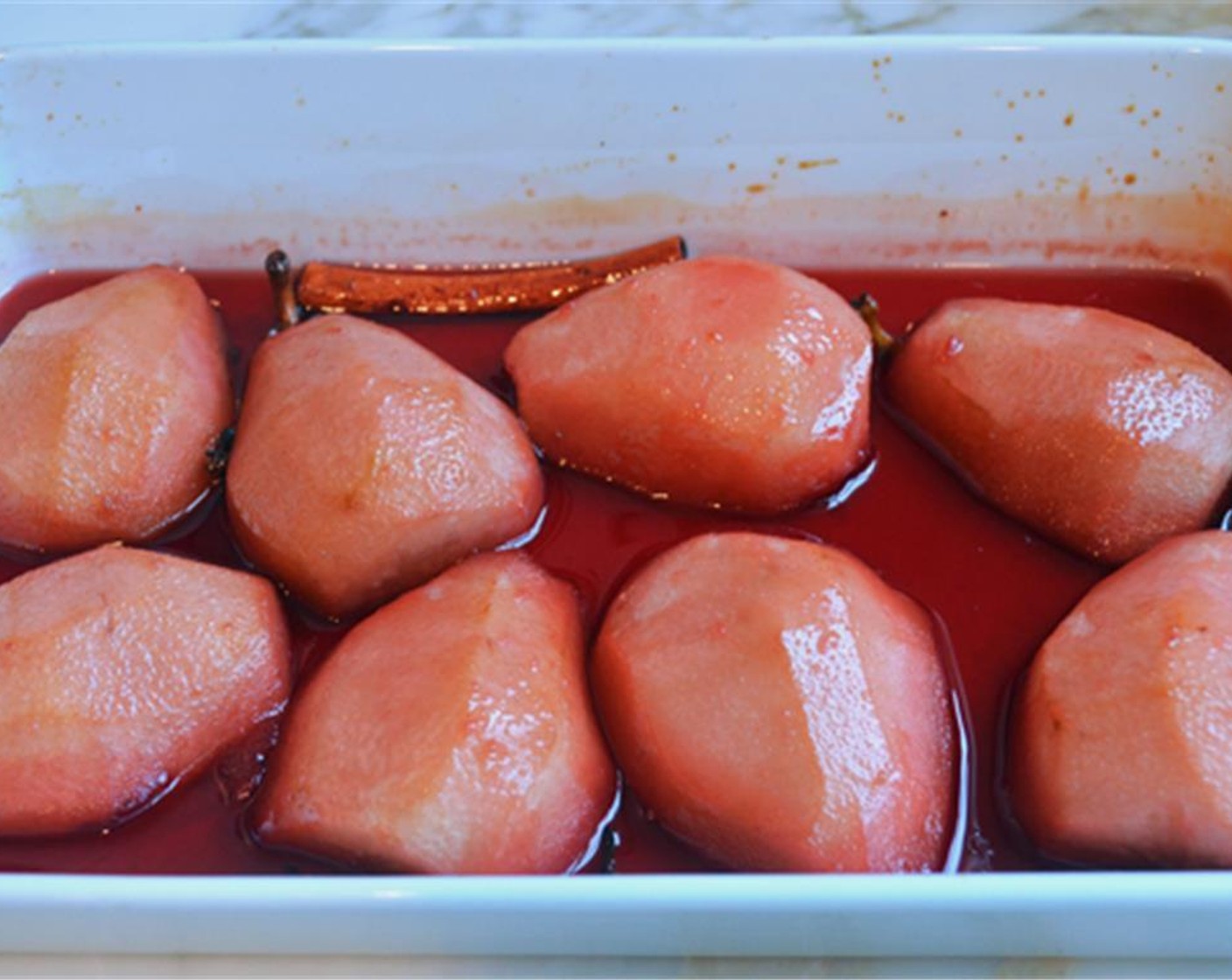 step 5 Pour the pomegranate syrup over the pears and place the dish in the oven. Bake for about 45 minutes, basting occasionally, until the pears are tender and easily pierced with sharp knife.