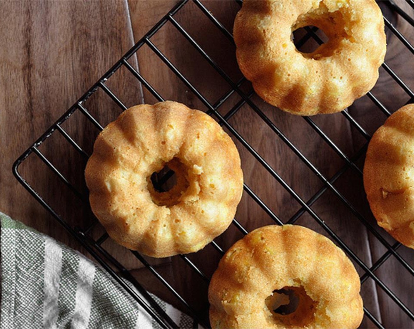 step 12 Once baked, remove the pan from the oven and allow to cool on a rack for about 20 minutes. Run a knife along the edges of each cake to loosen it. Invert the pan onto a tray or cooling rack; the bundt cakes should come right out.