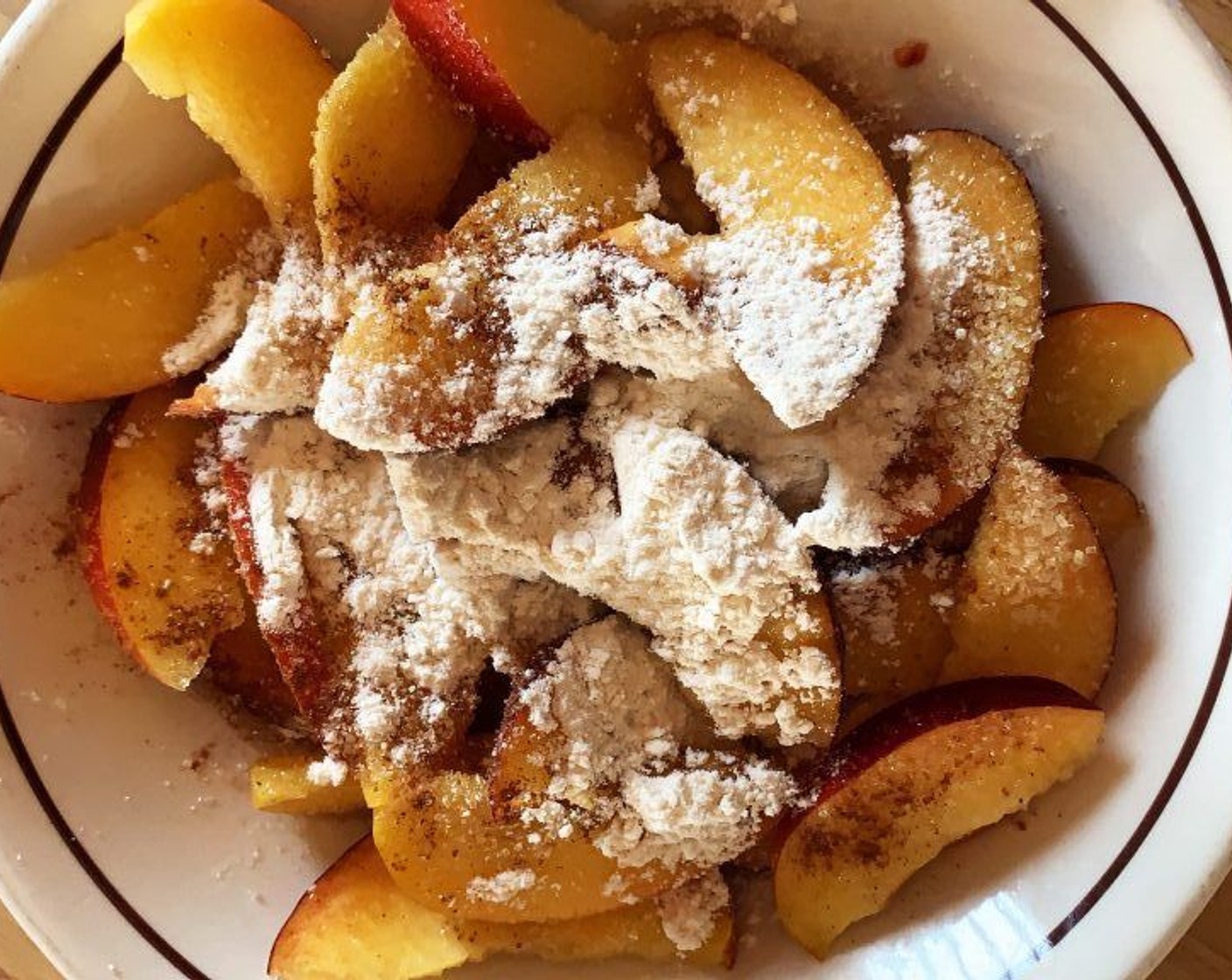 step 5 Meanwhile slice the Peaches (3) and dress them in the reserved lemon juice, Cane Sugar (2 Tbsp), Tapioca Starch (2 Tbsp), Simply Organic Cinnamon, Ground (1 dash), and Salt (1 pinch).
