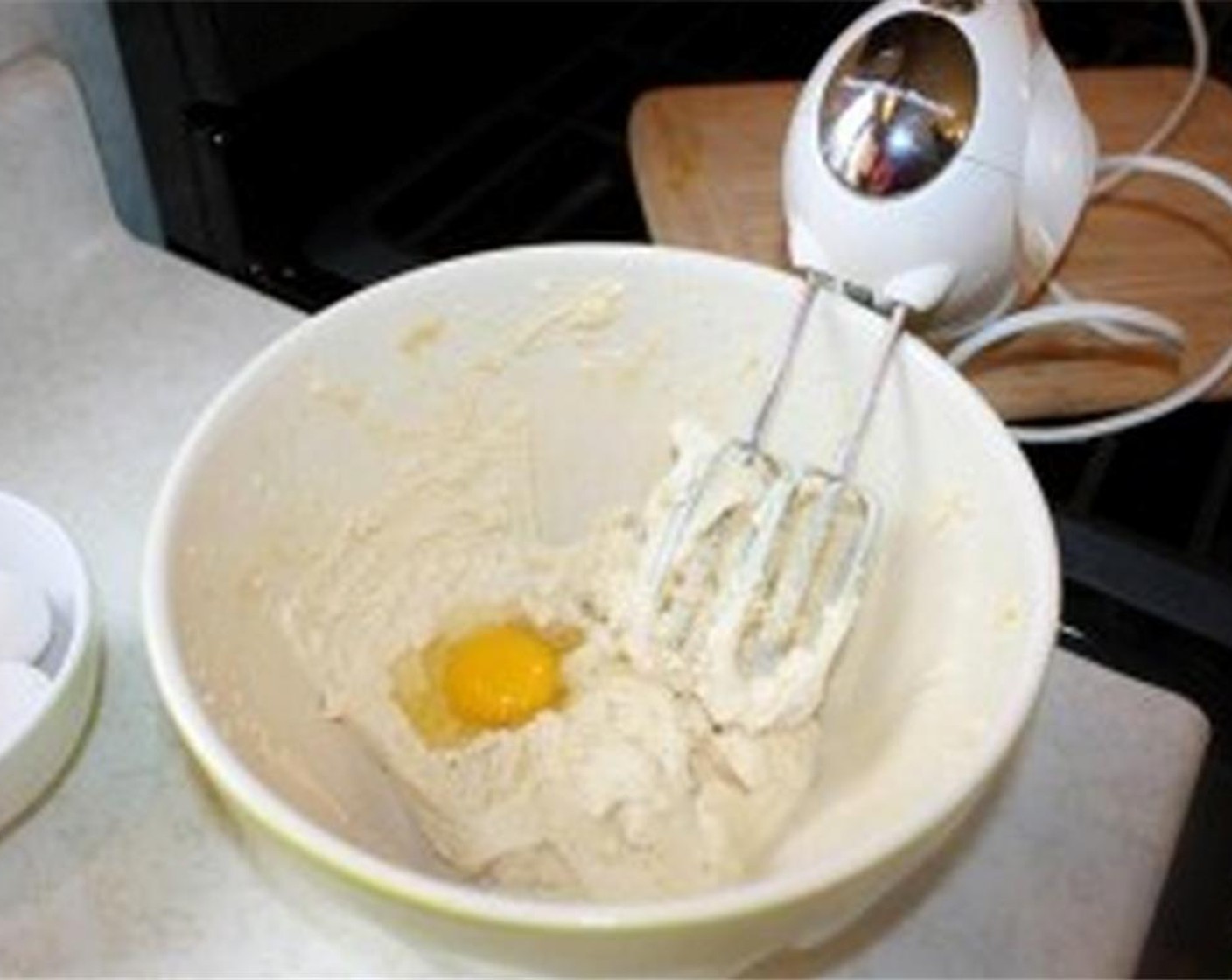 step 7 After you have a smooth and fluffy batter base, start adding the Eggs (6) one at a time and mix thoroughly.