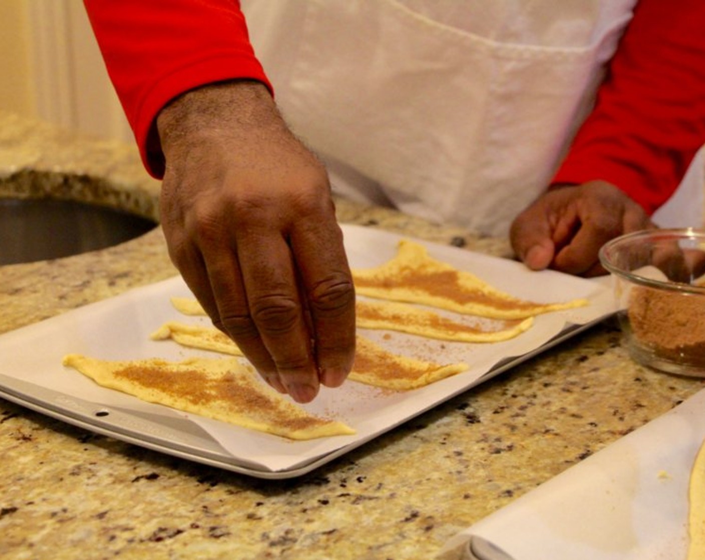 step 6 Sprinkle sugar mixture evenly among triangles then place an apple slice at the wide end of the triangle.