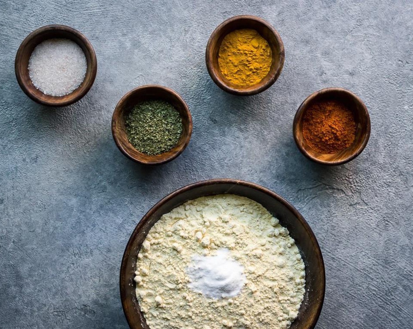 step 4 In a bowl, combine Chickpea Flour (1 cup), Palm Shortening (1 dash), Fine Salt (1/2 tsp), Fresh Oregano (1/4 tsp), Ground Turmeric (1/4 tsp), Cayenne Pepper (1/4 tsp), and Baking Soda (1/2 tsp). Whisk to combine.