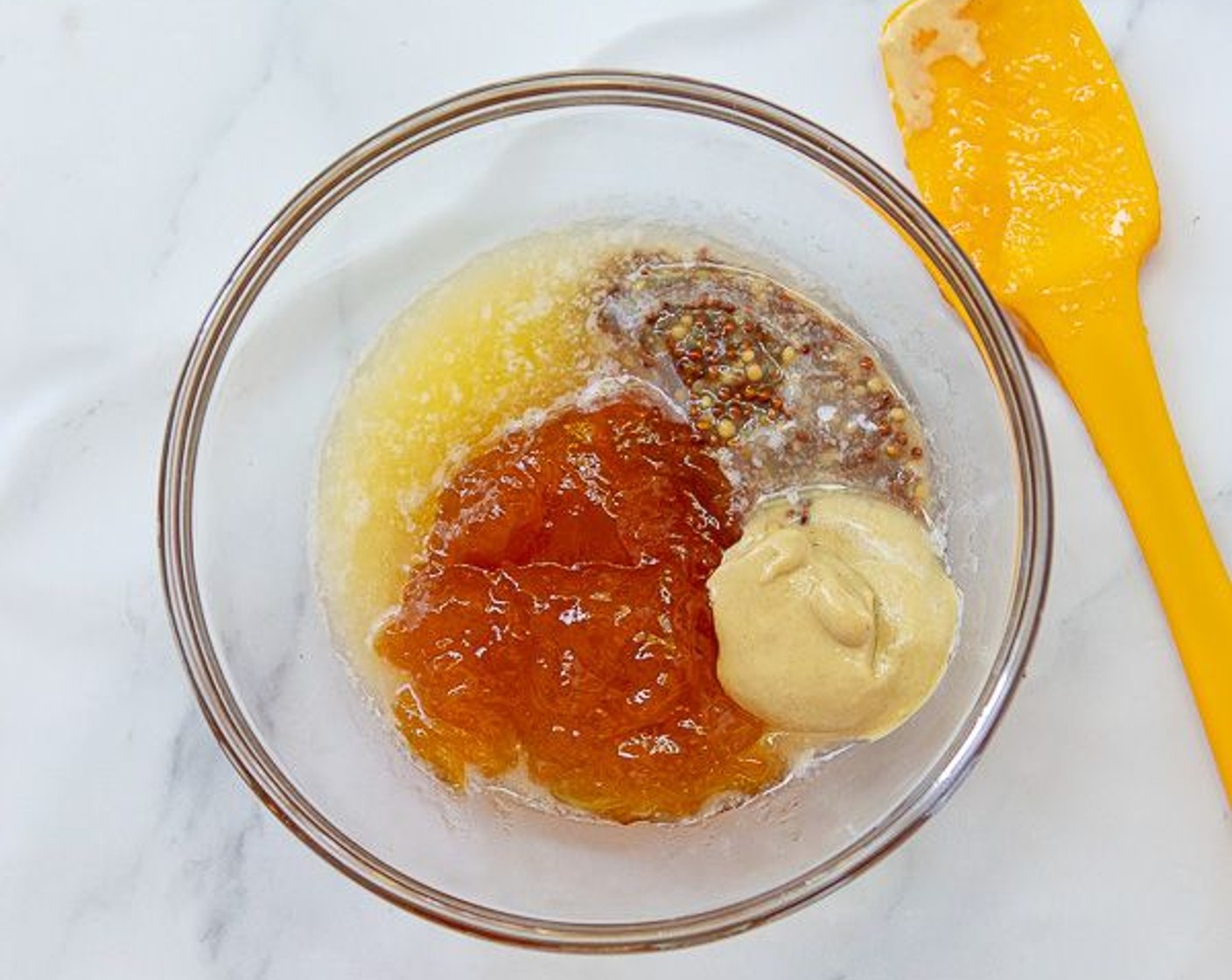 step 2 In a small microwave-safe bowl melt Butter (1 Tbsp). Add Apricot Preserves (4 Tbsp), Whole Grain Mustard (1 Tbsp), and Dijon Mustard (1 Tbsp). Mix well. Remove 2 tablespoons of mustard sauce and set aside to use after salmon is cooked.