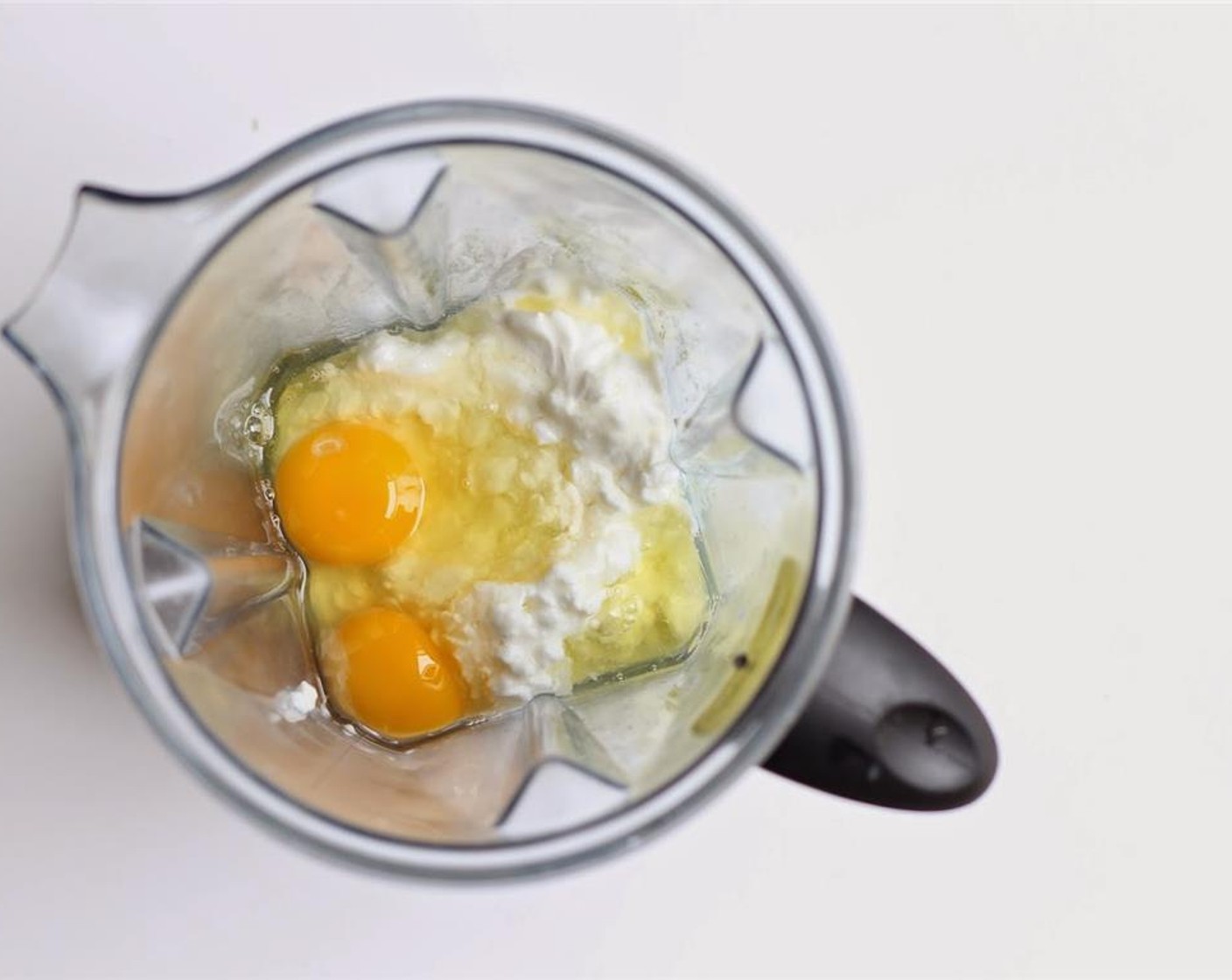 step 1 Pour Cottage Cheese (1 cup) and Eggs (4) in a blender.